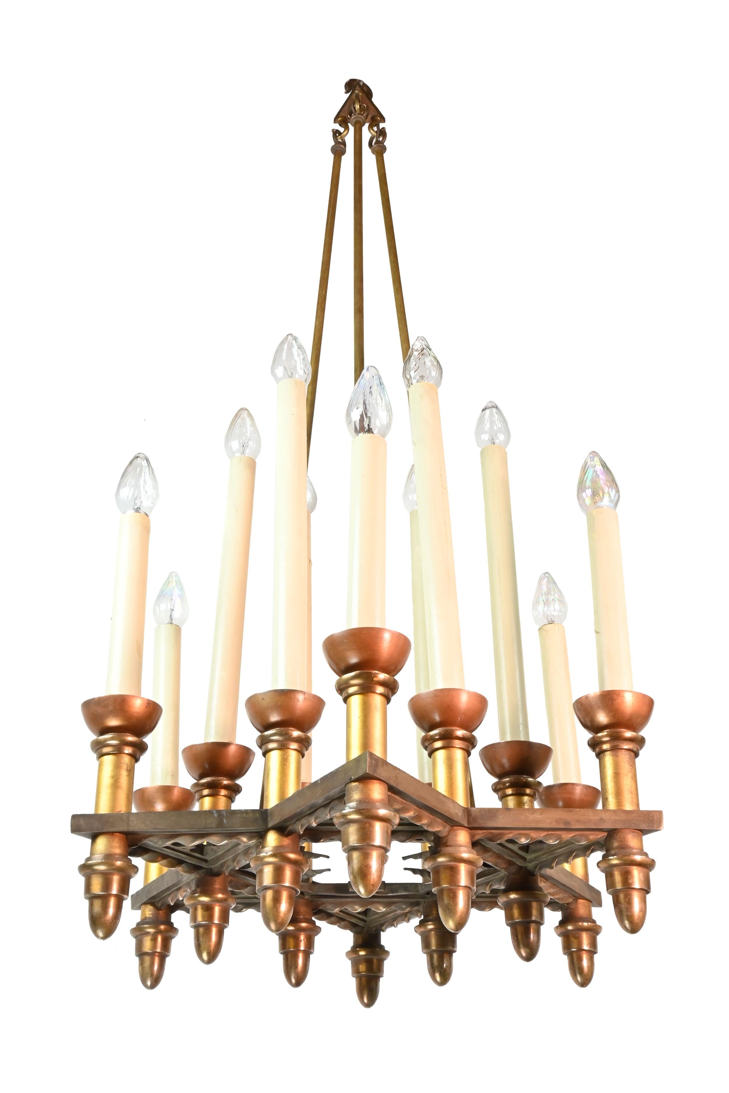 This unique chandelier from the early 20th century incorporates traditional Gothic ornamentation in a pattern of points with lancet shaped trefoils incorporated into the frame of a Star of David. The base of the frame features spiraling, rope like