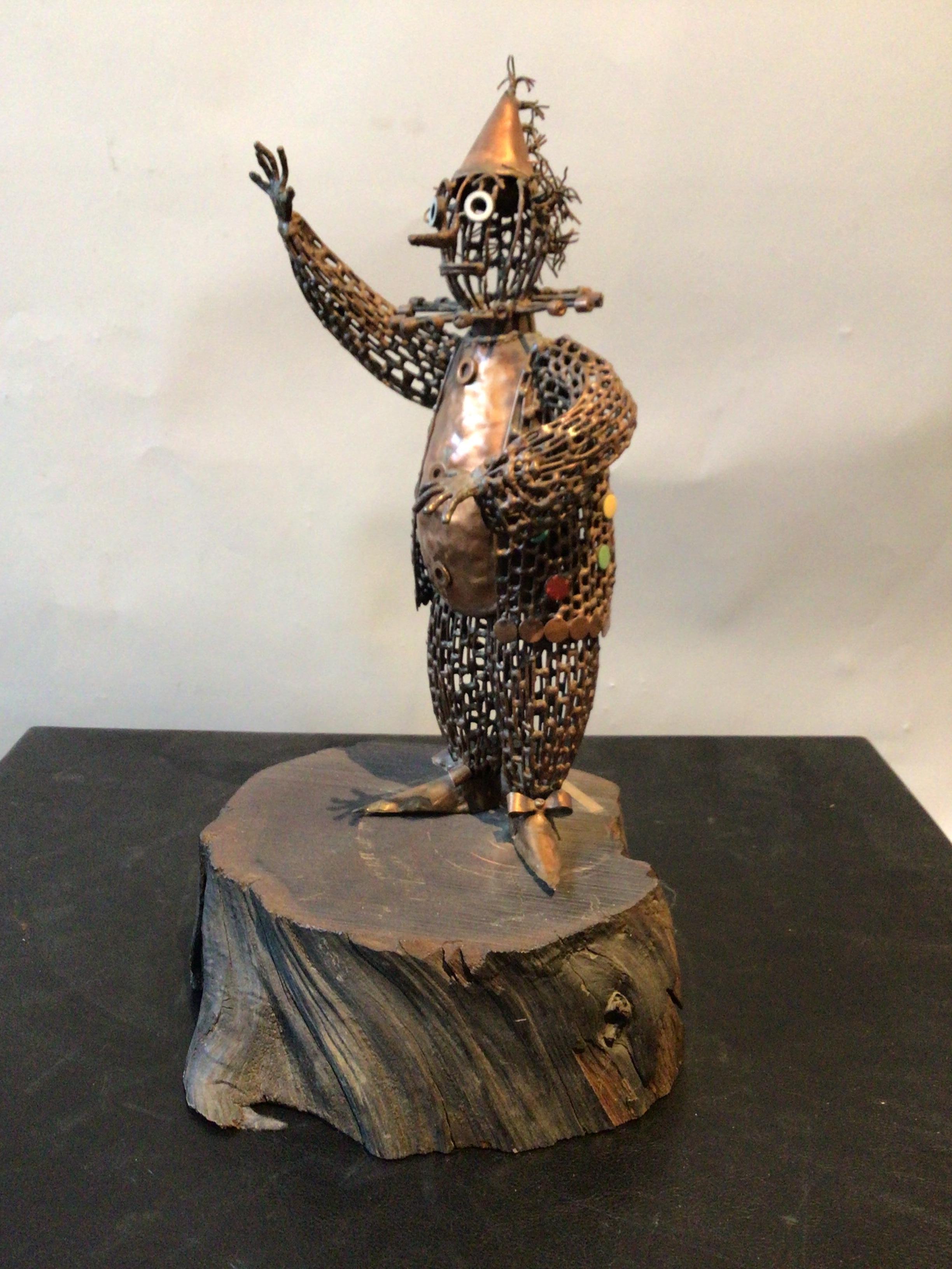 Iron and copper clown sculpture, signed Maxine Burnett.