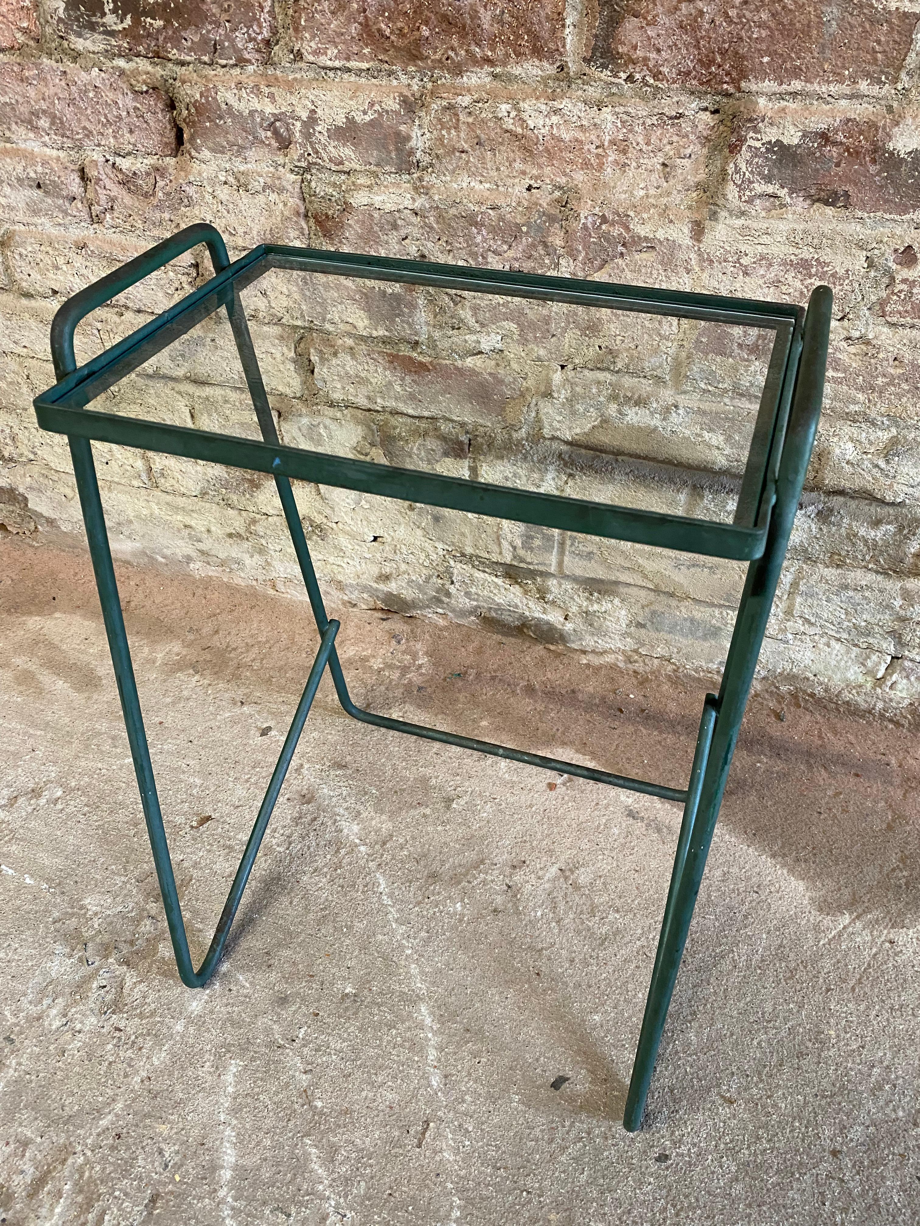 Iron and glass top hairpin leg end table. Sweet accent table for any space in the home. Circa 1950. Green iron frame with glass insert. Good overall condition with some scuffs and finish losses.

Measures: Approximately 11.5