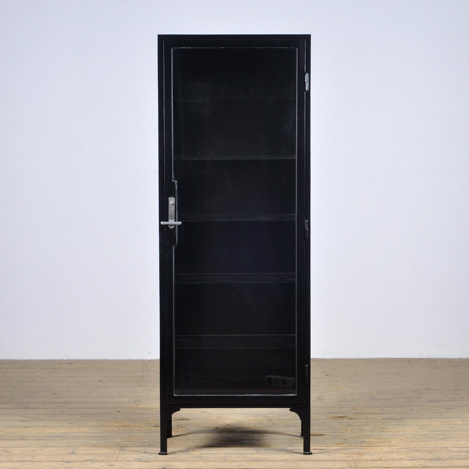 Medical cabinet from the 1930s. The cabinet is produced in hungary and is made of thick iron and antique glass. The lock and handle are original and functional.
The cabinet has been painted black recently.