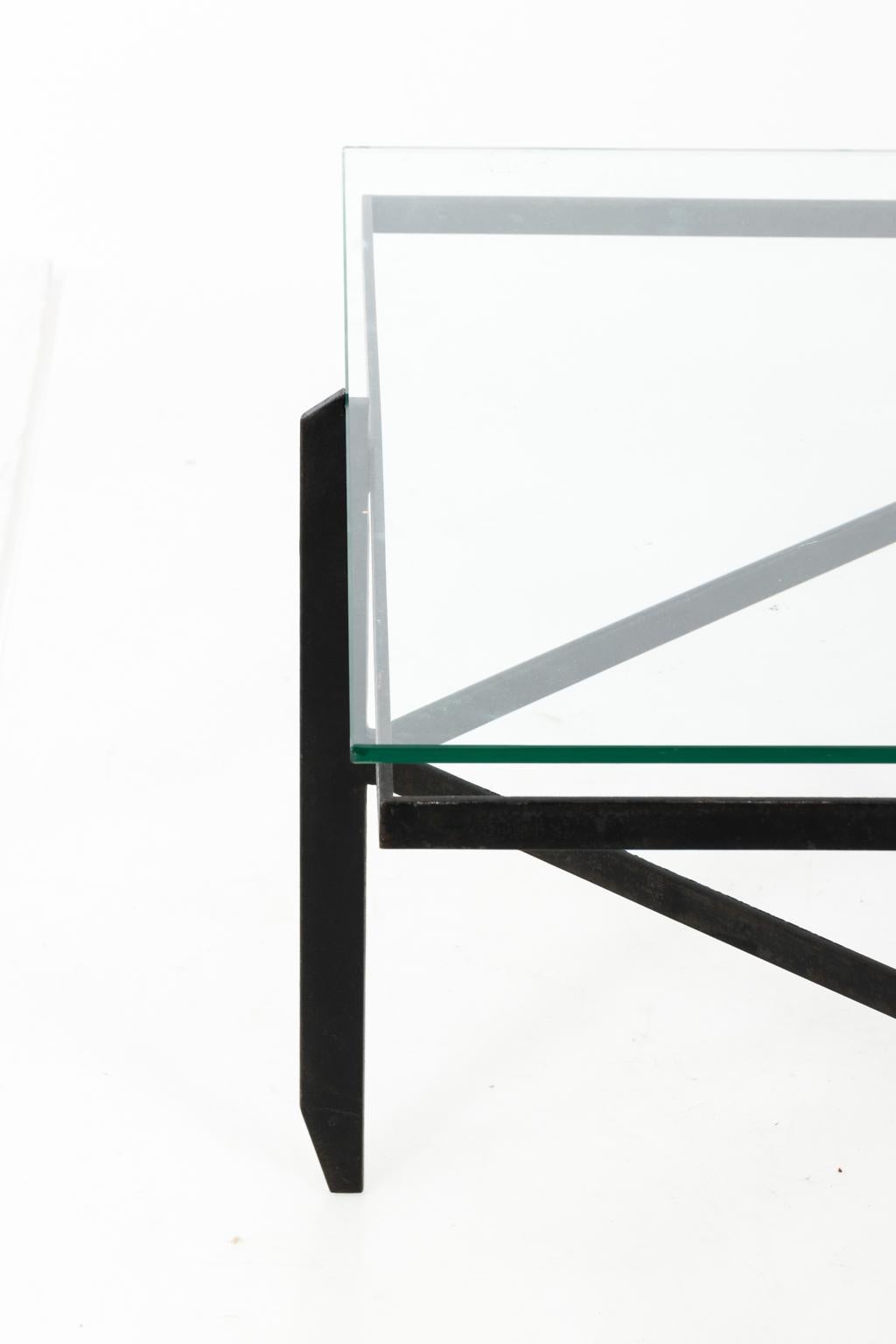 Mid-Century Modern style Iron frame coffee table with glass top, circa 1950.
 