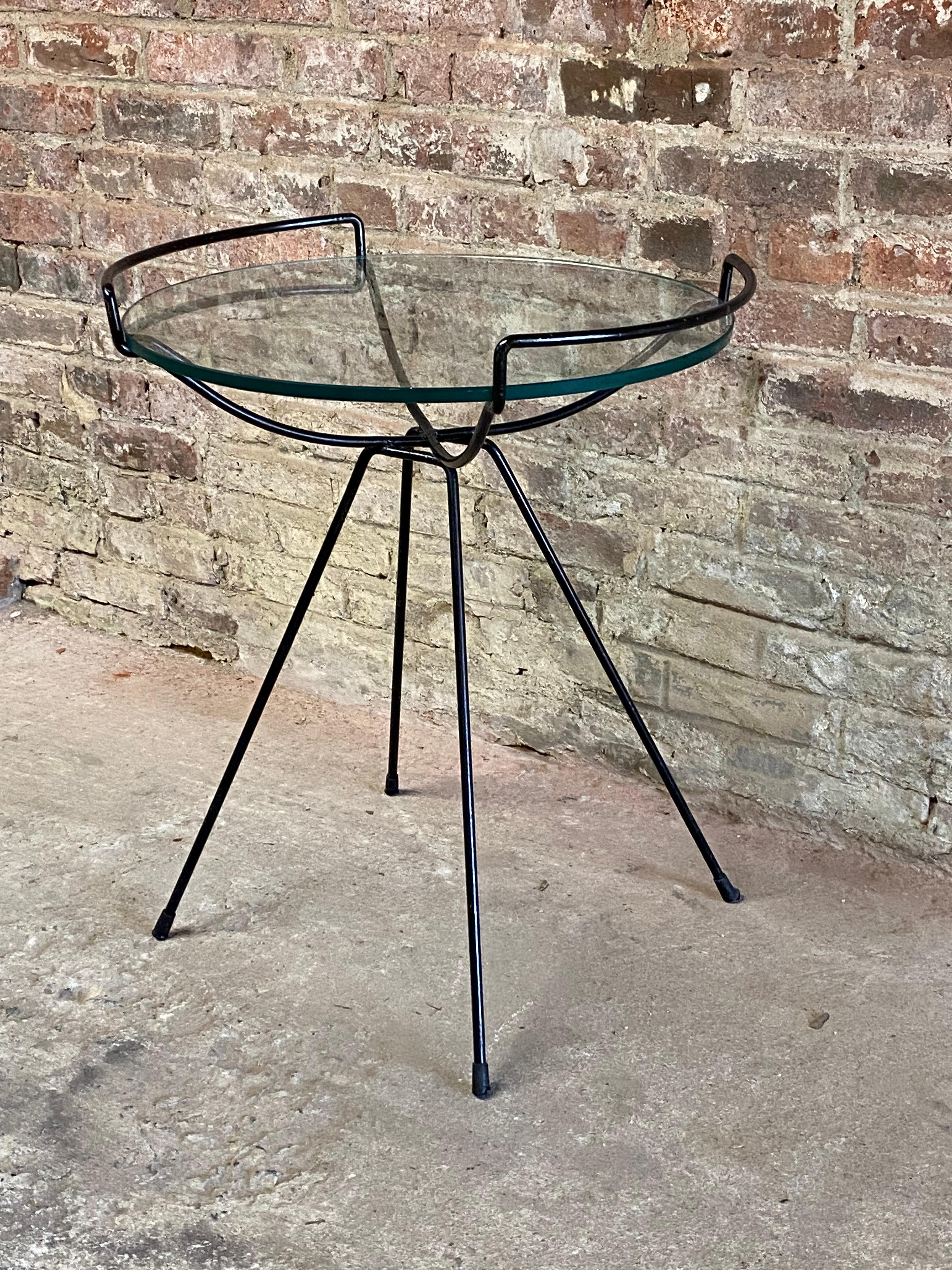 Glass and iron table in the manner of Sol Bloom. Circa 1950-60. Reminiscent of Sol Bloom's famous Catch All design. Removable glass. Structurally sound and sturdy. All welds are intact. The glass edge has some very minor flea bite dings (see photos)