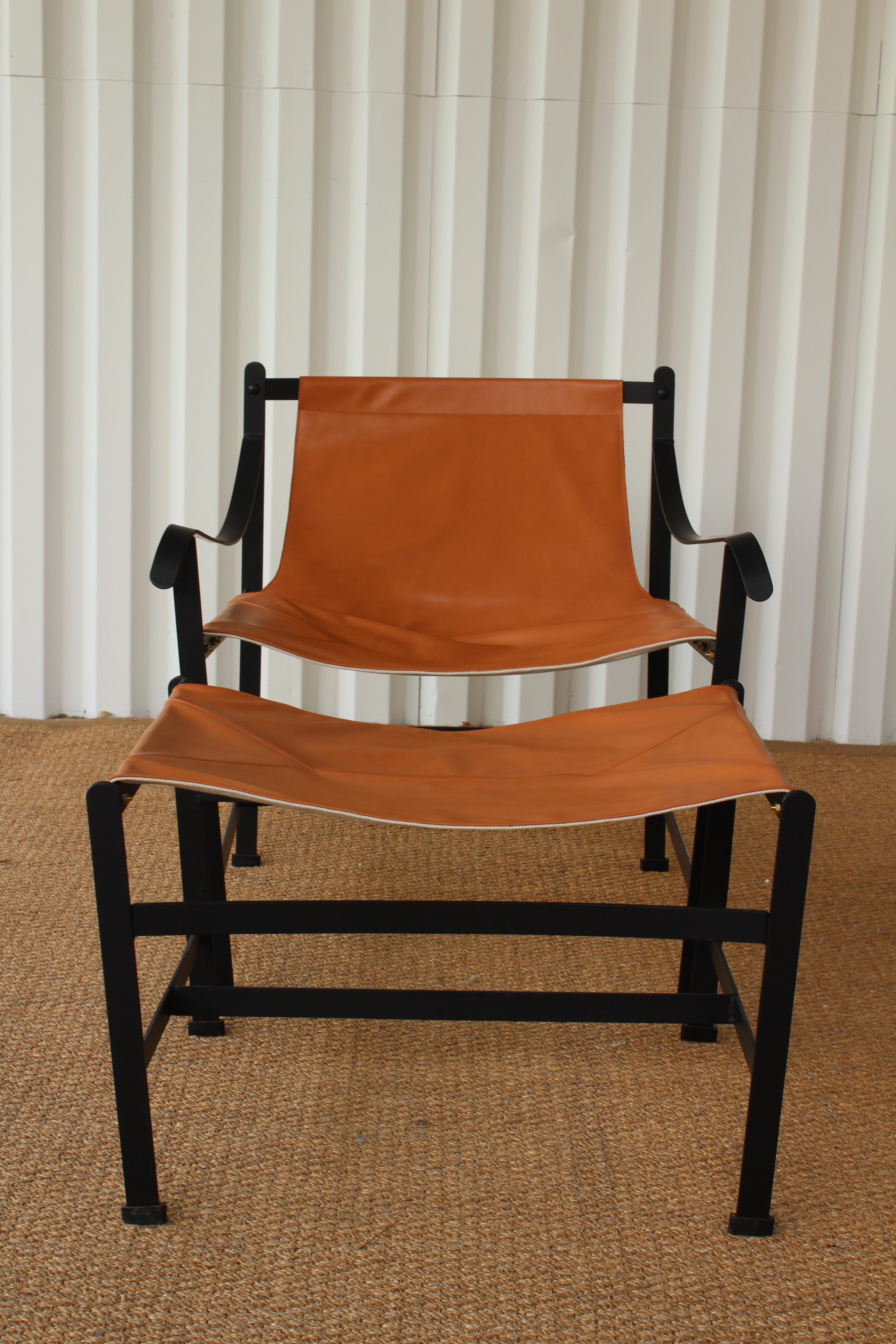 Iron and leather sling chair in the manner of William Katavolos. Iron frame has been professionally powder-coated. The leather sling is new.