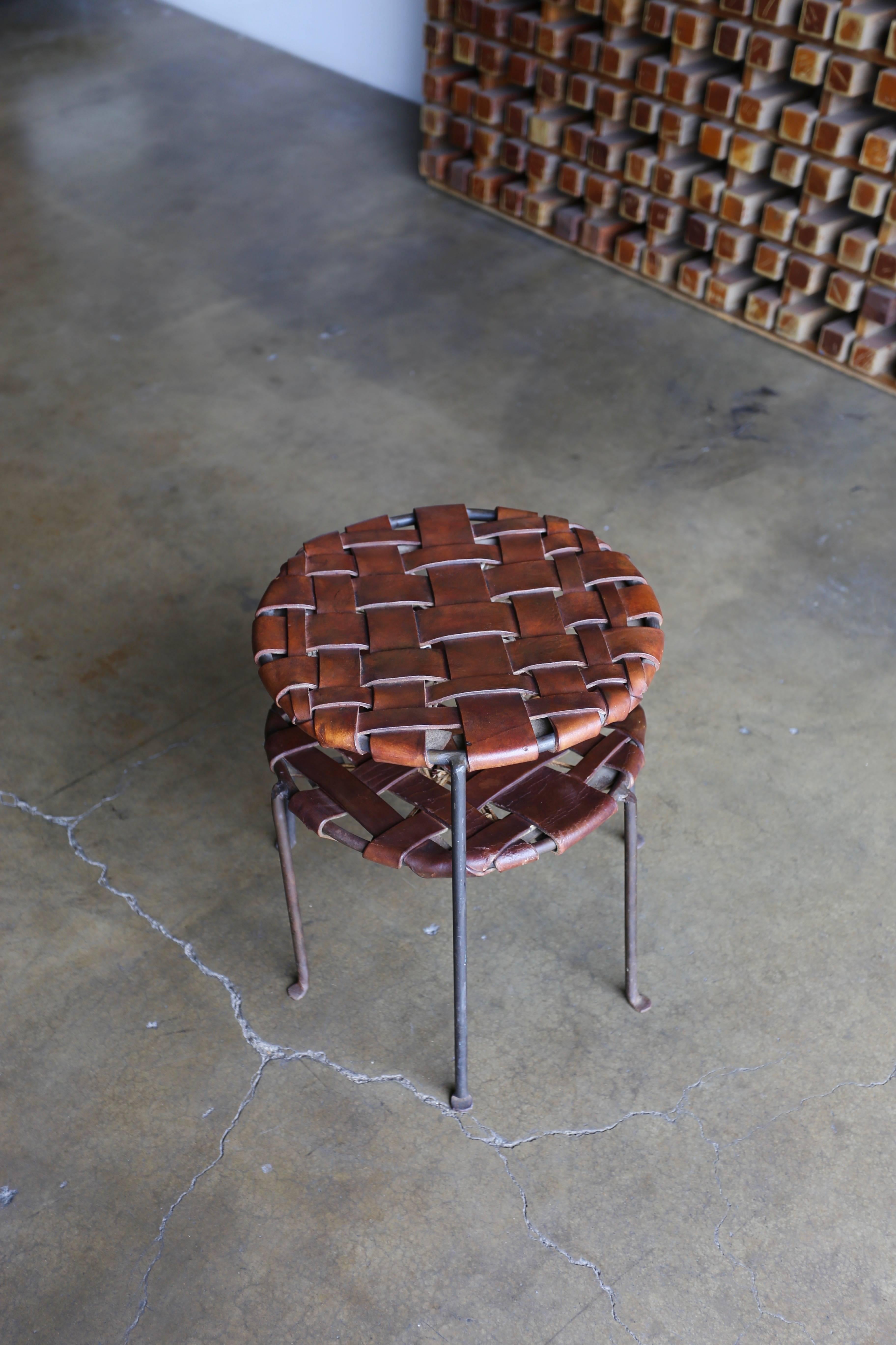 Iron and leather stools by Lila Swift and Donald Monell.

Measures: 16.25