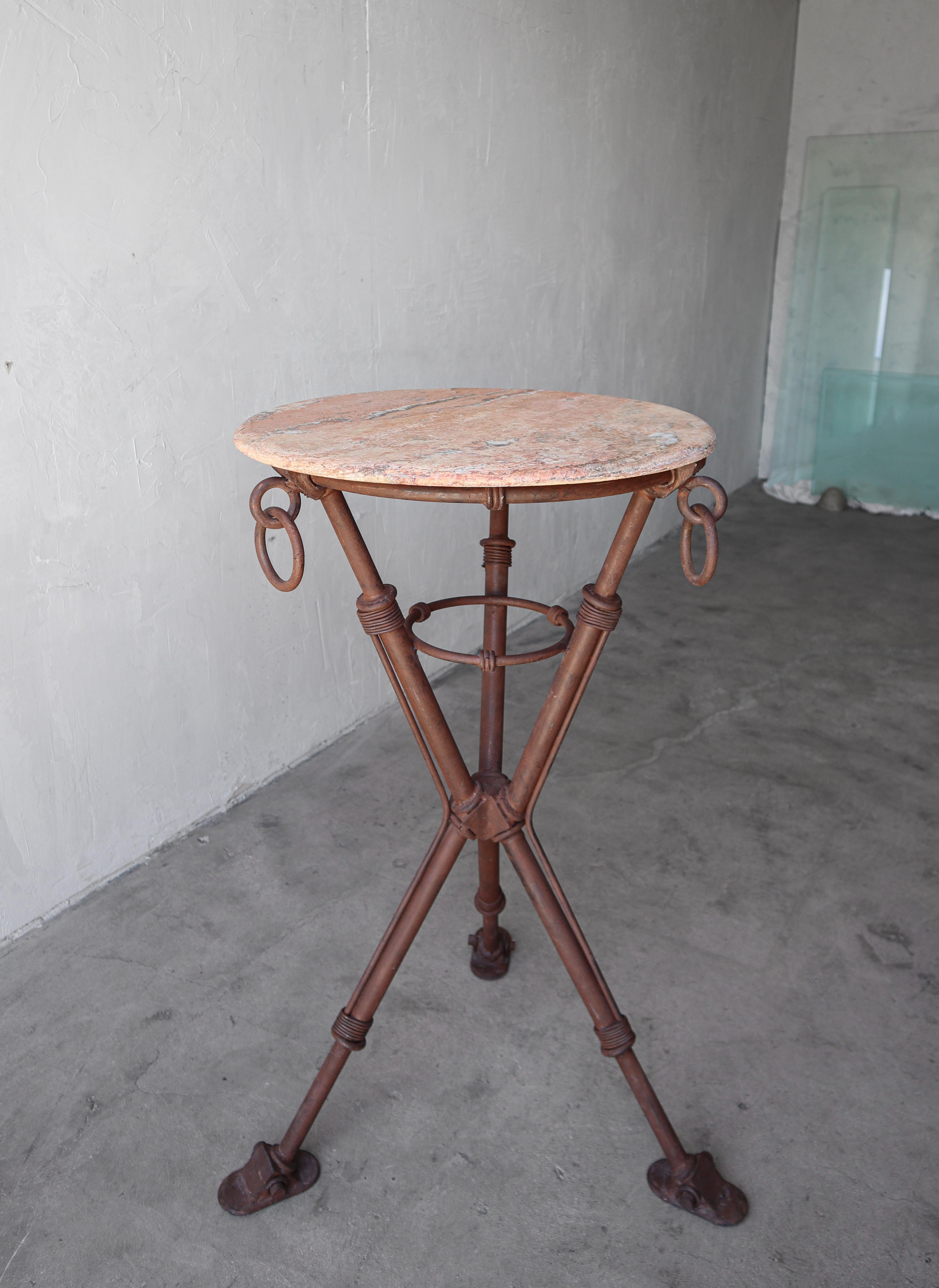 Substantial iron bar table with honed marble top. This piece is substantial, and unique, the base easily weighs 75+lbs.  Could also be used as a pedestal for a piece of art.