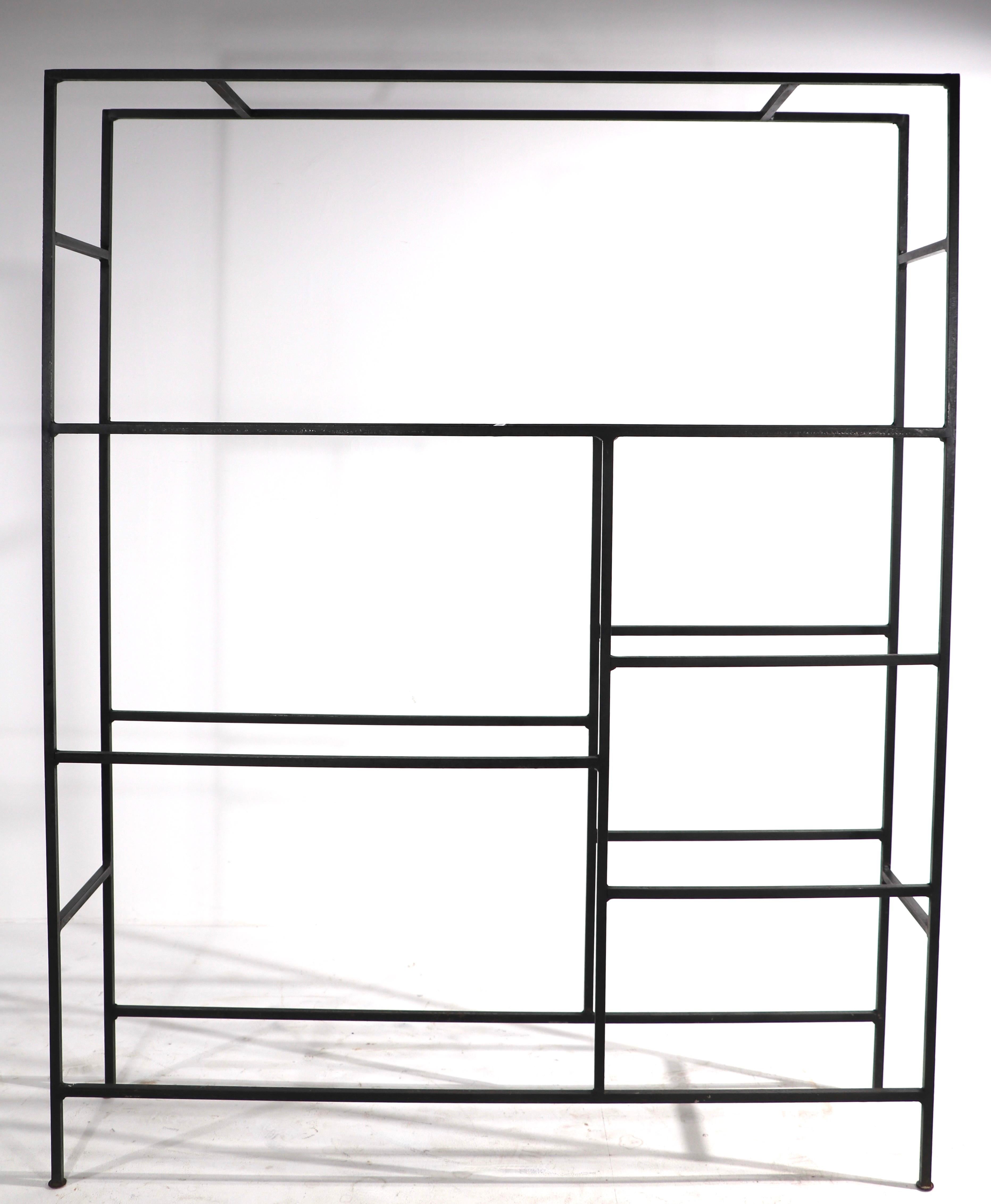 Unusual and rare mid century shelf unit having an iron frame, with marble, and metal mesh shelves. The marble shelves fit into iron frames, which fit into the iron structure frame, they can be placed in various positions to suit your needs, please