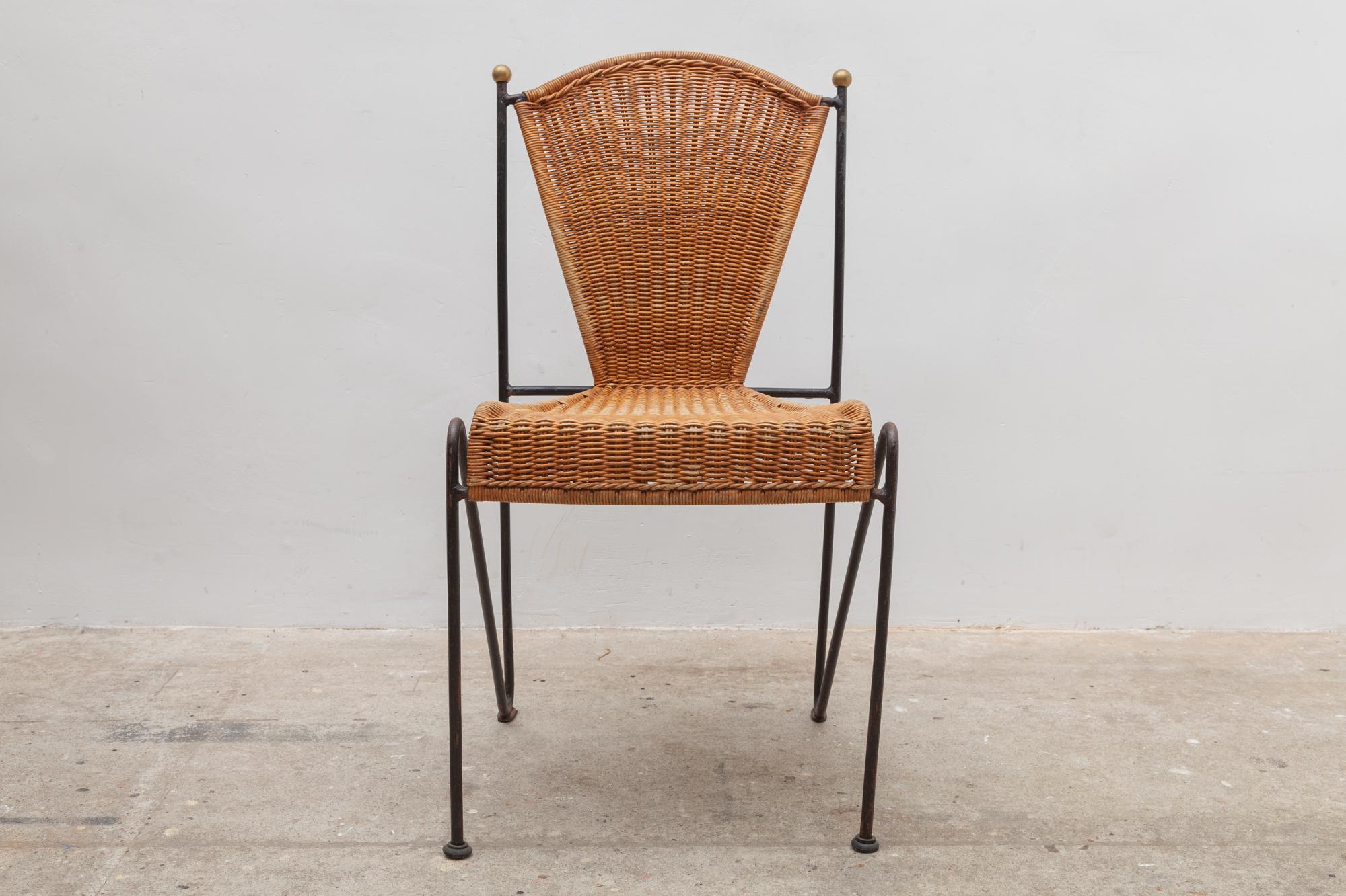 Vintage dining chair set indoor, outdoor dining chairs by designer Pipsan Saarinen Swanson for Ficks Reed.Sculptural black iron frames with gold ball ends. Woven rattan seats. Set of 8 chairs, two which have arm rests.
Dimensions:No armrests: 44W x