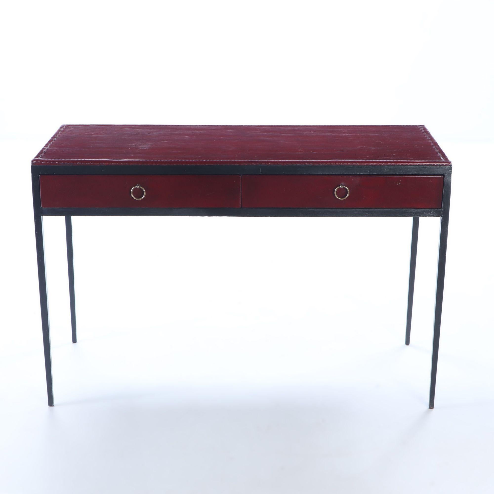 Iron and red leather writing desk having two drawers in the manner of Jean-Michel Frank. Custom orders possible.
