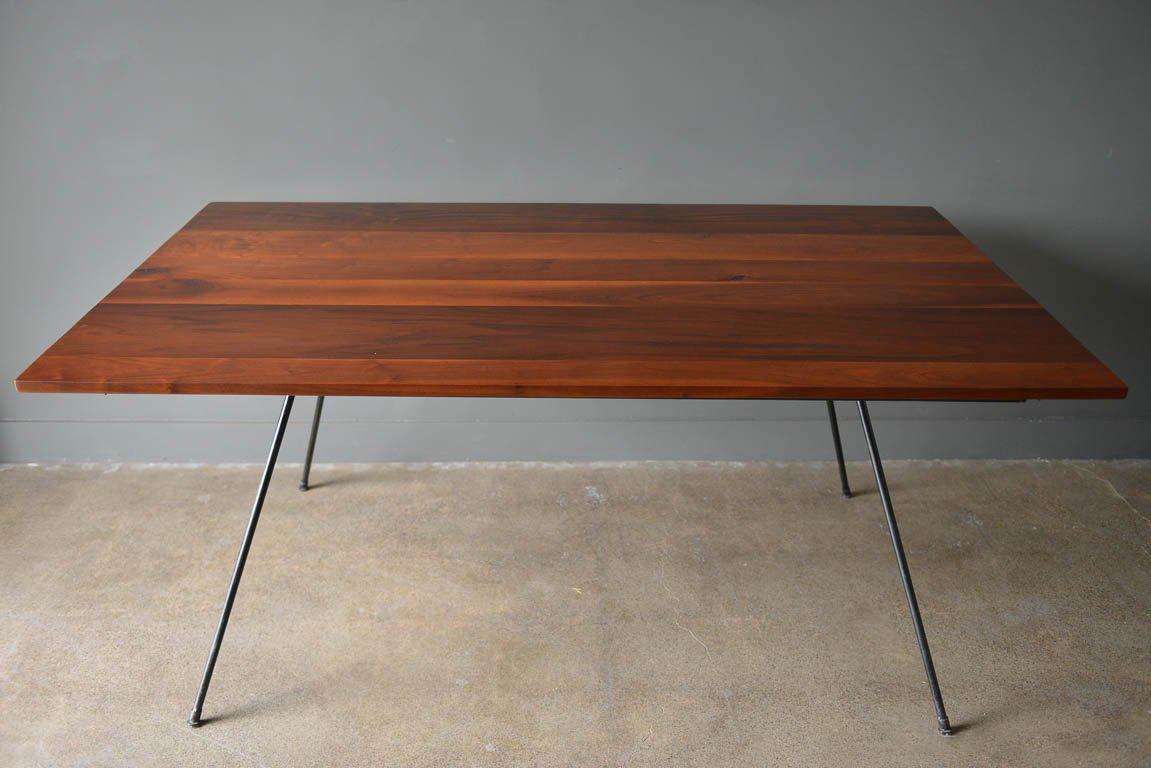 Iron and walnut slab dining by Milo Baughman for Pacific iron products, circa 1965. Walnut slab as been professionally restored in showroom condition. Unused and new. Iron frame is very good with minor wear, no rust. Retains original feet. Beautiful