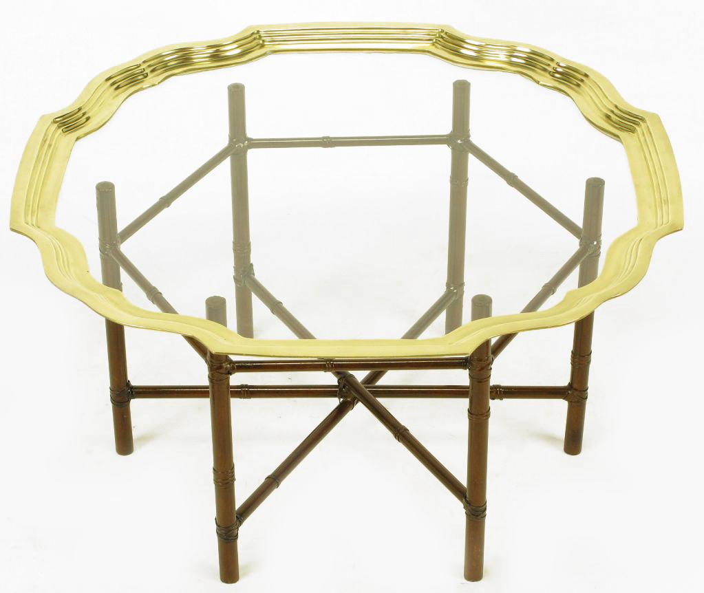 Chocolate lacquered 6-leg iron base petite coffee table with faux bamboo detailing and metal ribbon binding. Brass stepped rim glass tray top. Similar to designs offered by Baker.