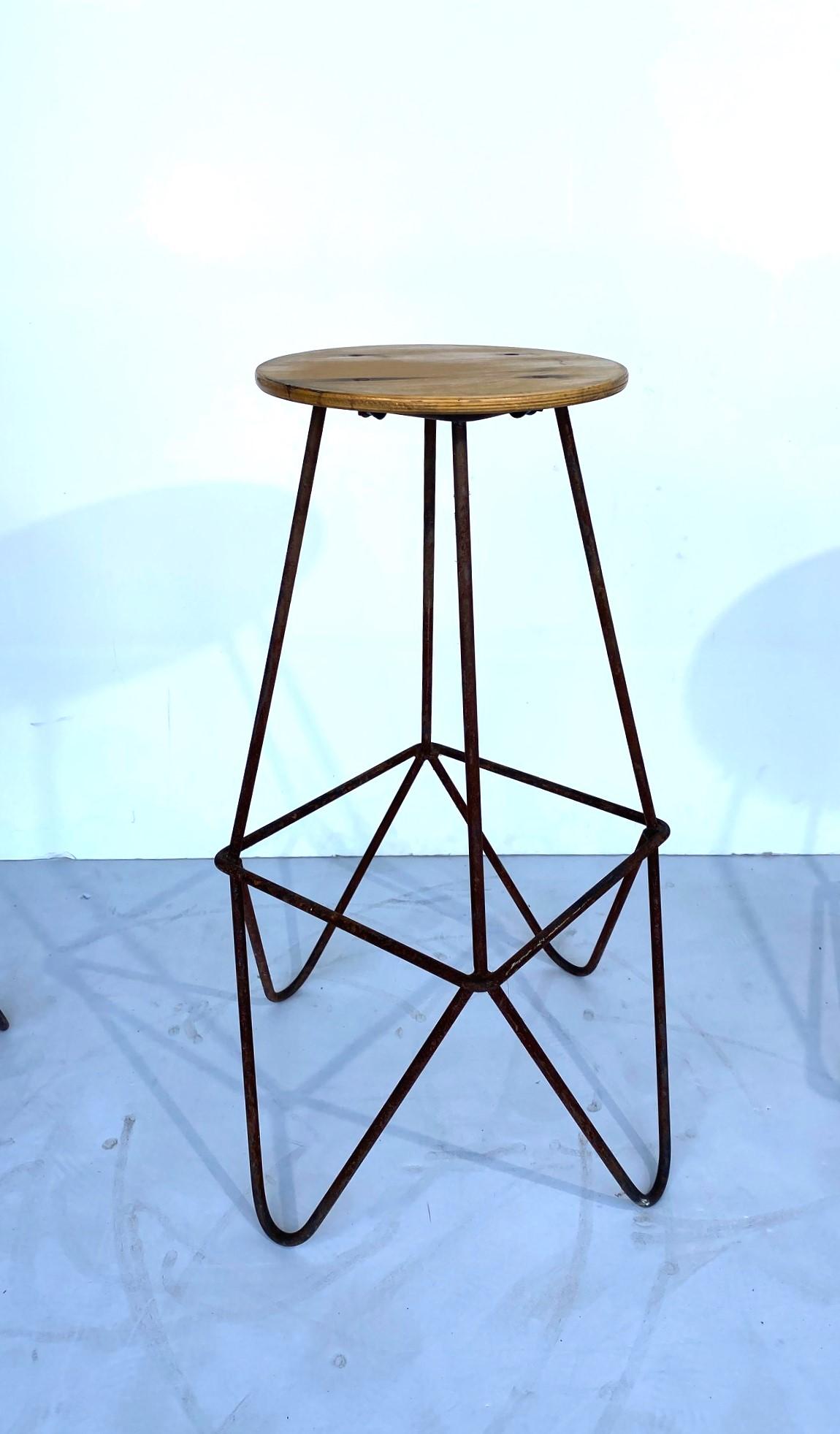Set of three iron base barstools. The seat has four screws that attach to the base.