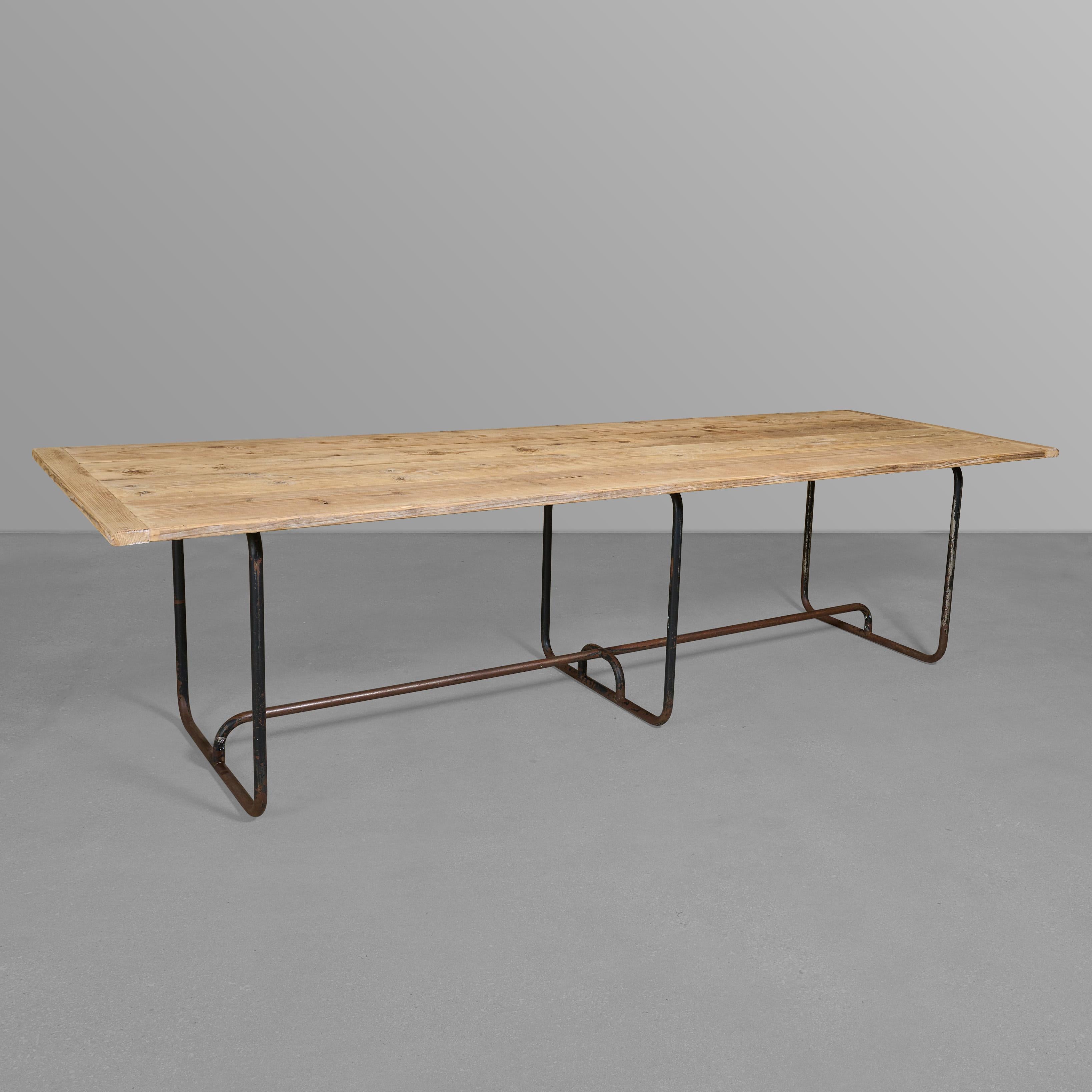 Fantastic six leg iron base table with wonderful pine top. Very cool, great design.

