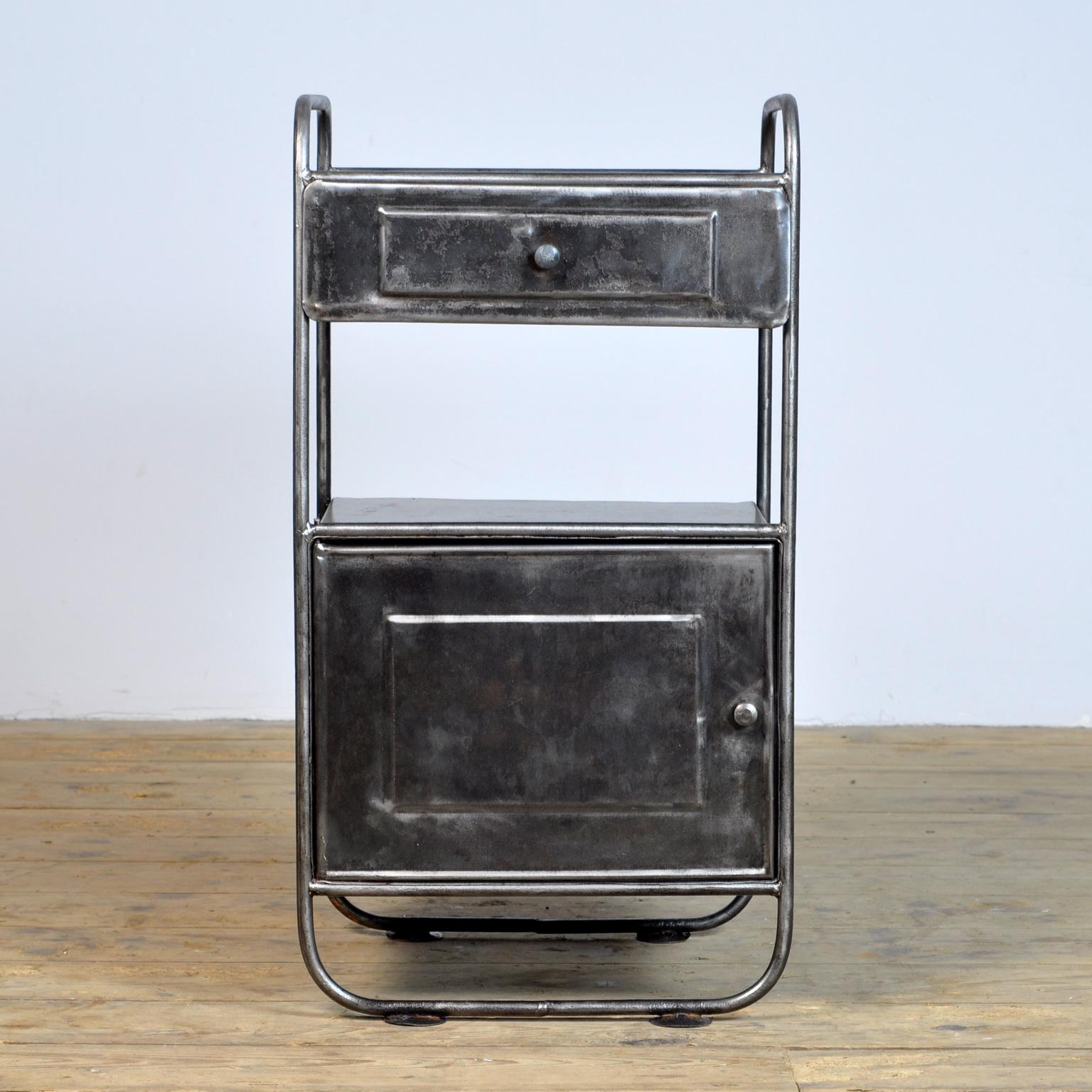 Bedside table in the Bauhaus style, made of polished iron. Treated against rust, circa 1930.