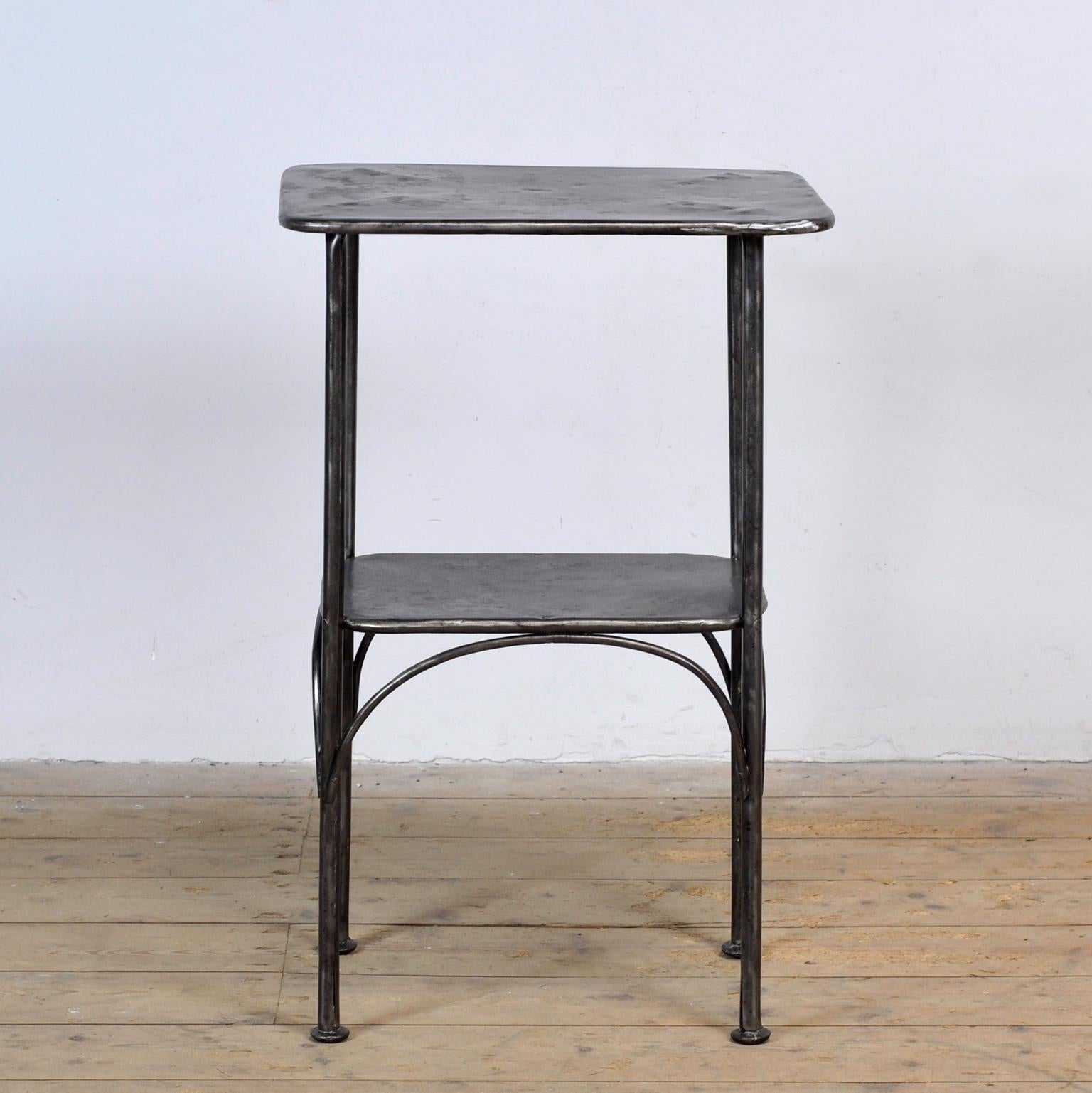 Bedside table made of iron. From a hospital in Budapest. The table has been stripped from its paint and treated against rust. Circa 1910.