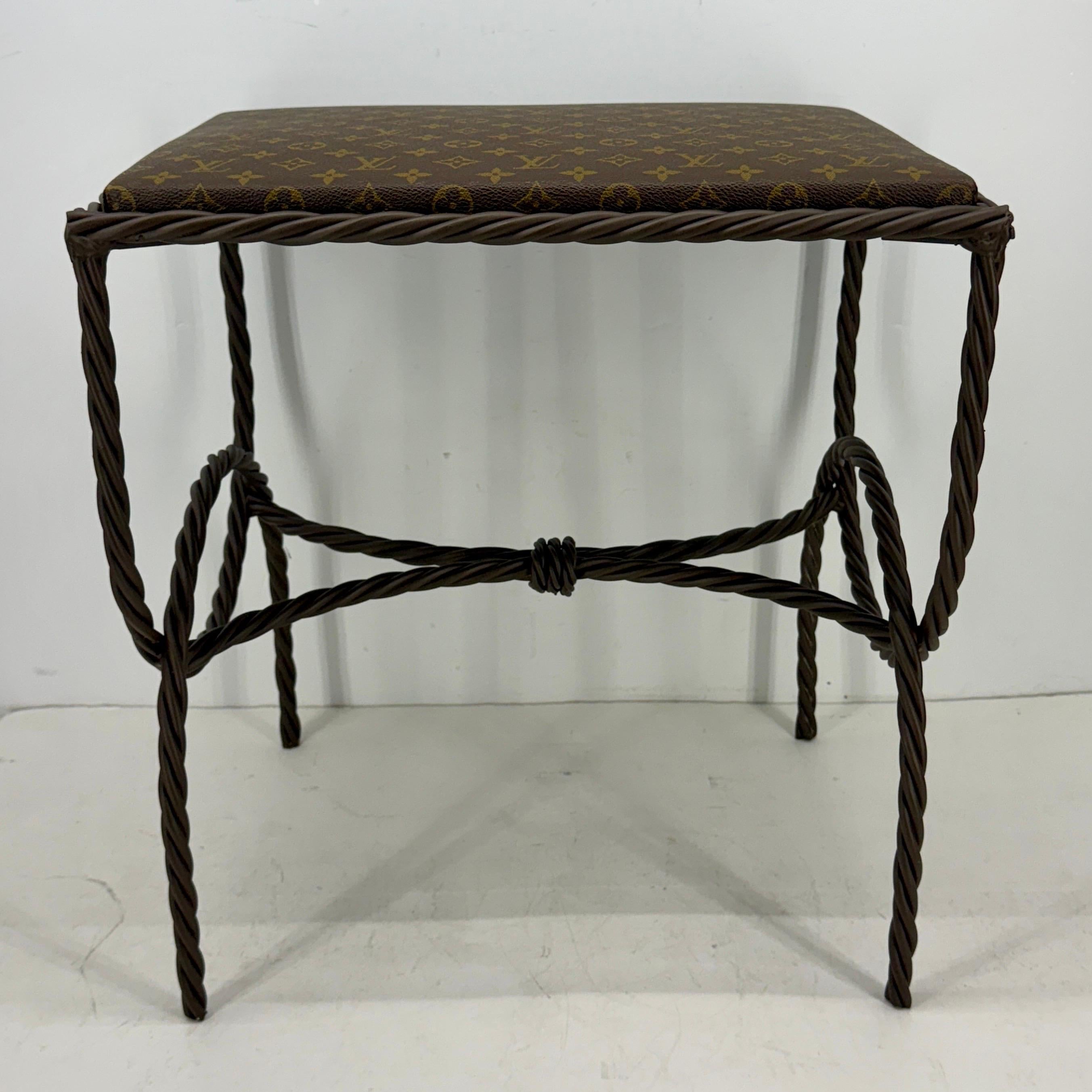 Rope Bench, Stool or side table with Louis Vuitton Monogram Fabric. Design and purpose best describe this custom piece.  Features authentic classic Monogram Louis Vuitton fabric seat atop very sturdy painted rope benches in a warm neutral brown