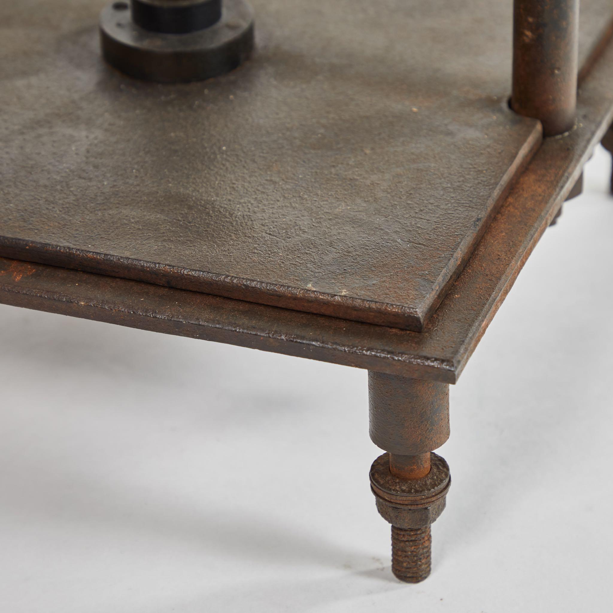 An iron book press, originating in France, circa 1890.