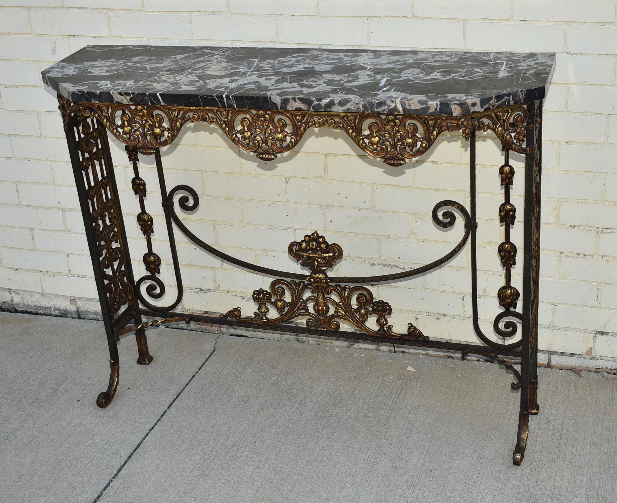 Antique circa 1920s hammered iron and bronze marble top entry console table and mirror. Nicely designed metalwork with original finish. Mirror measures 24.25