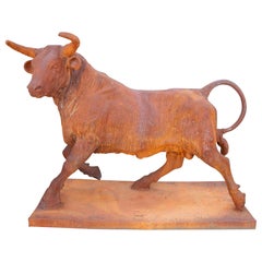 Iron bull sculpture with base and rust finish