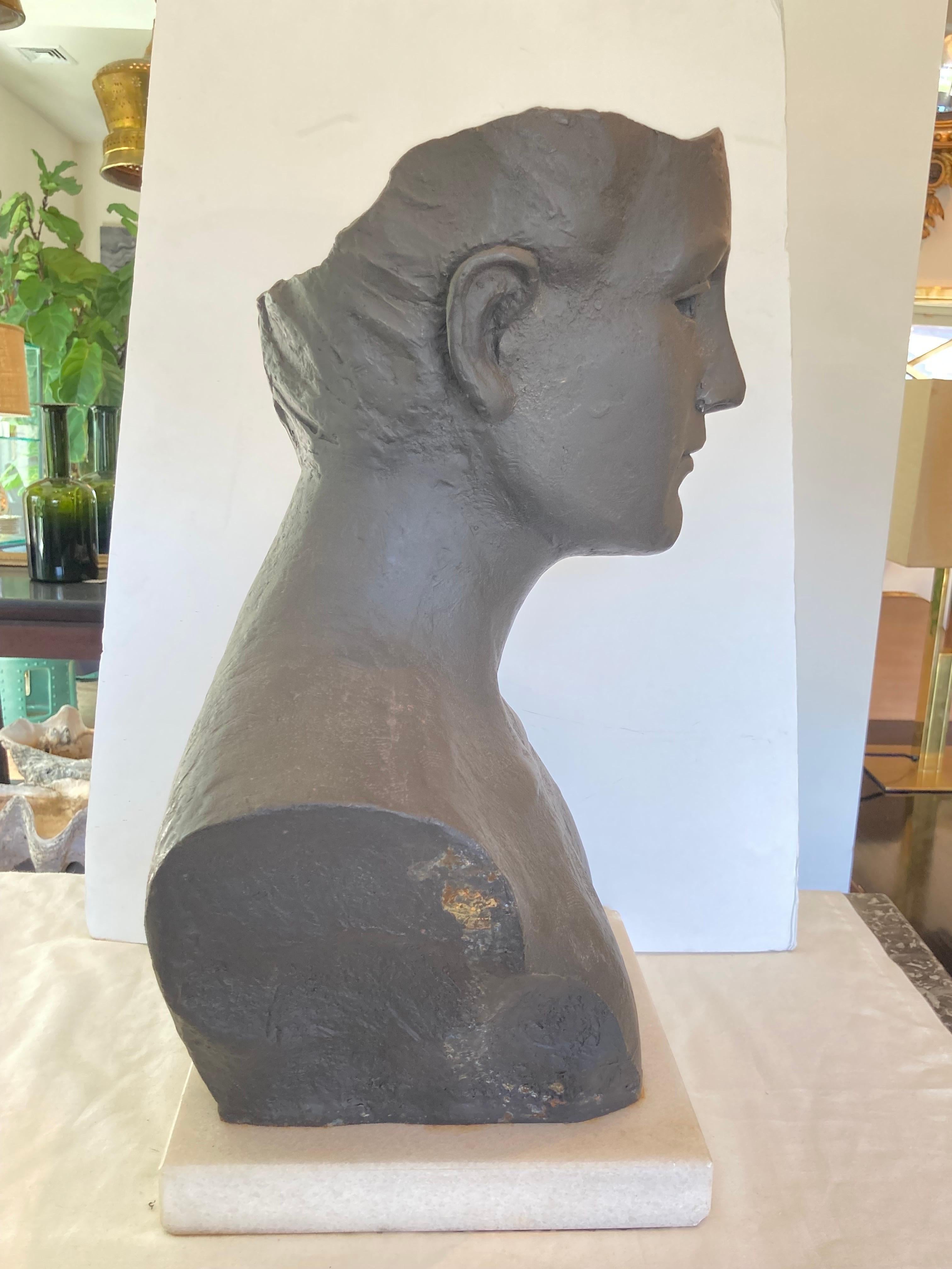Iron bust sculpture of a man, mounted on stone base... not signed, artist unknown...
Base measures: 10.25