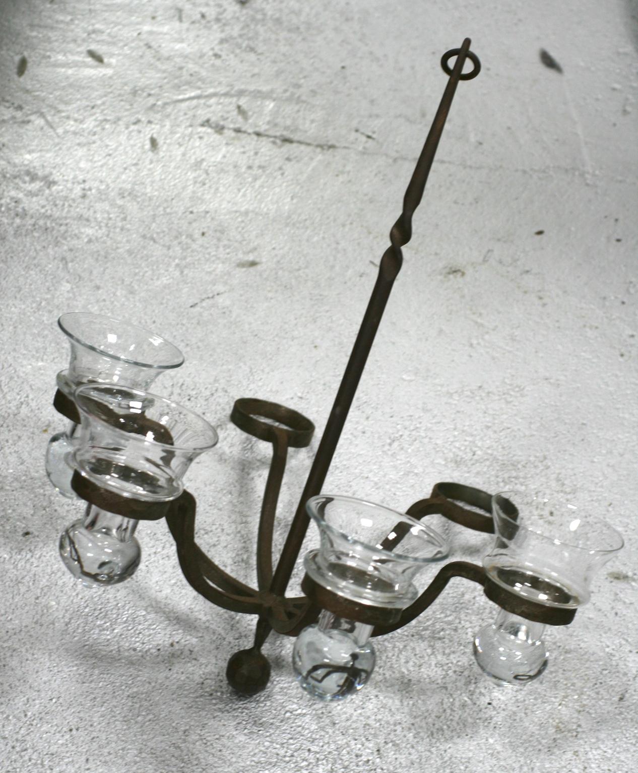 Elegant iron chandelier for Air Ferns or Votives with additional iron link stations for extending length. Each of the 6 glass holders can hold either a candle or air fern easily. Great for an enclosed porch or sun room.
21