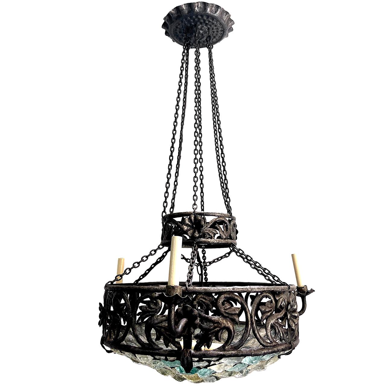 A circa 1920's Italian wrought iron three-arm chandelier with six interior lights and clear and blue art glass inset.

Measurements:
Diameter: 31