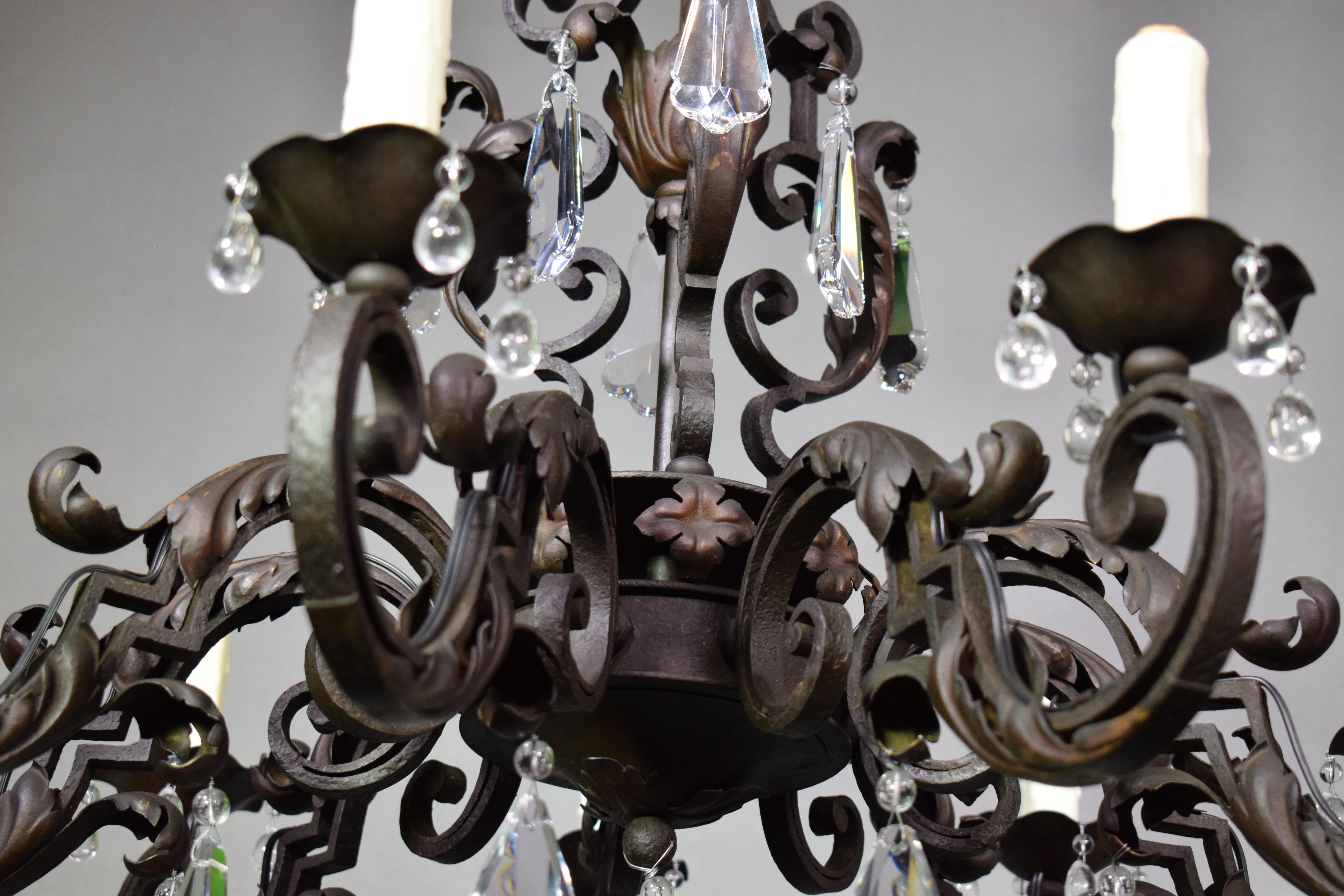 A very fine iron and crystal chandelier with crystal pendalogues. Exquisite hand-hammered work,
France, circa 1900.  9 lights.
Dimensions:  29.5
