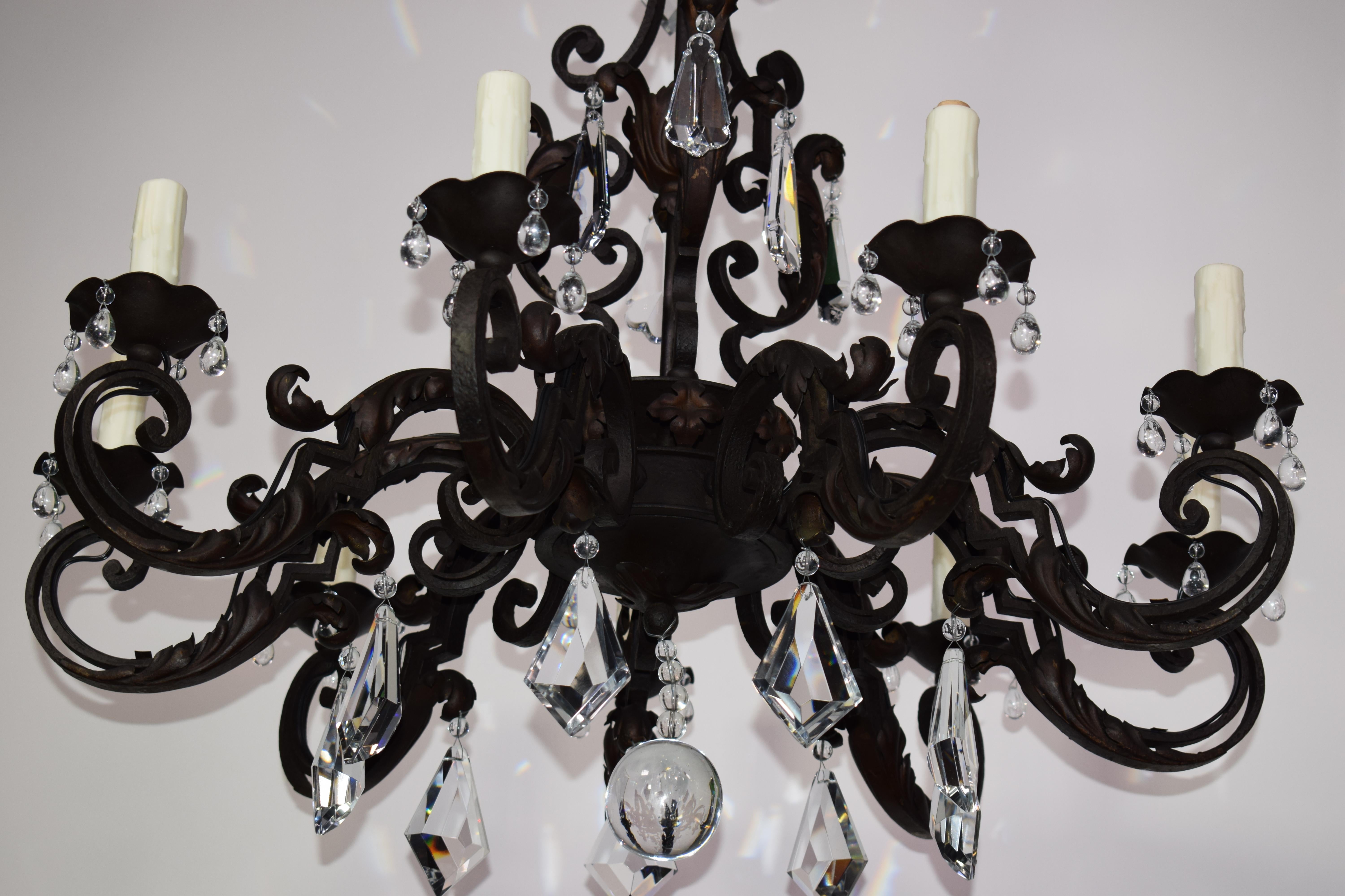 20th Century Iron Chandelier with Crystal Pendalogues For Sale