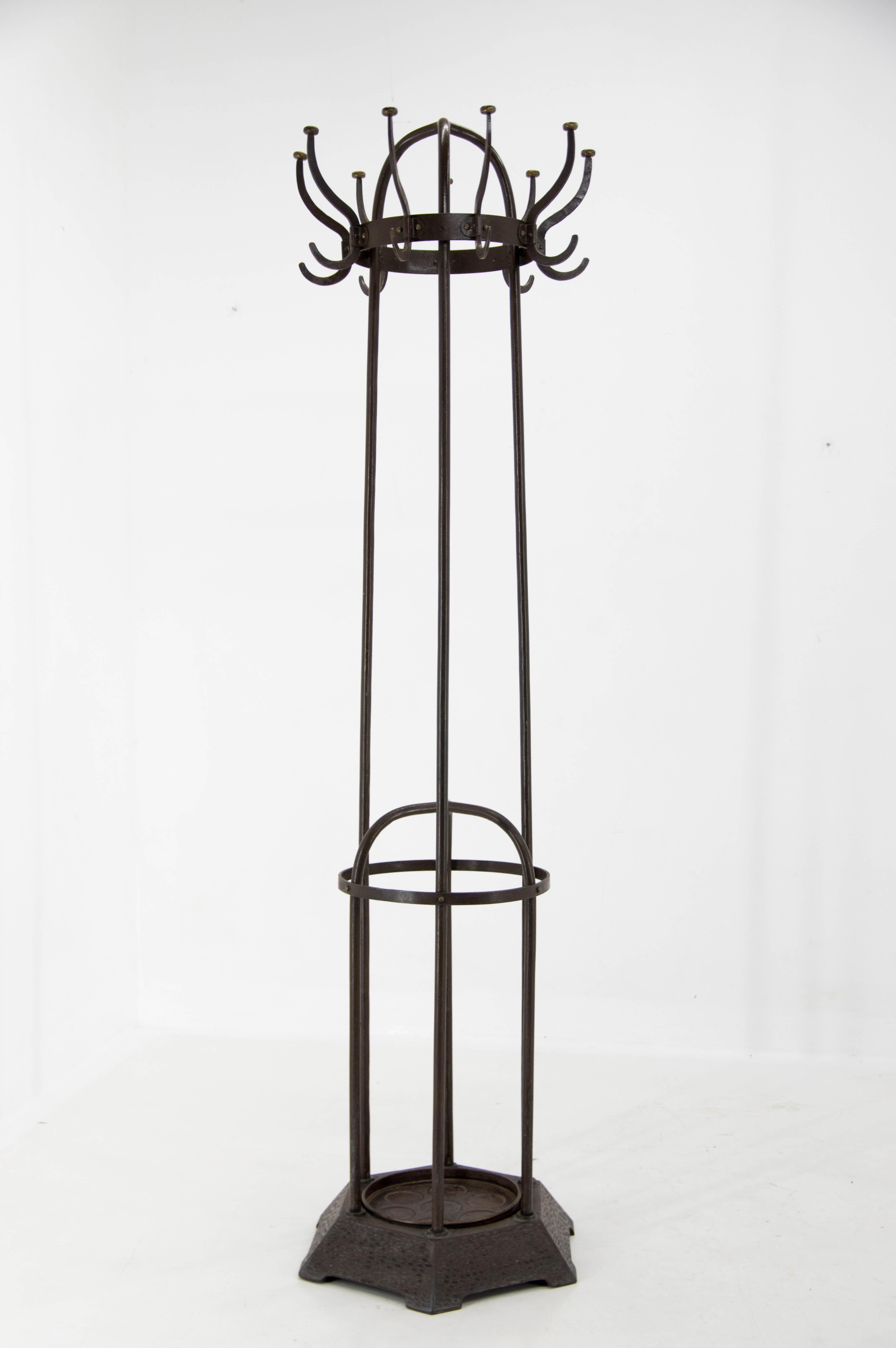 Wiener Werkstatte iron coat rack by Koloman Moser in a very good original condition. Dark brown paint with age patina. Including drip tray for umbrellas.
Shipping to US: $1100.