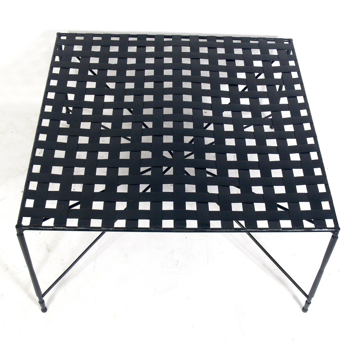 Sculptural iron coffee table, designed by Mario Papperzini for Salterini, Italian, circa 1960s. This is a versatile form and it can be used indoors or outdoors. This design was used by Yves Saint Laurent in his personal residence at la Rue de