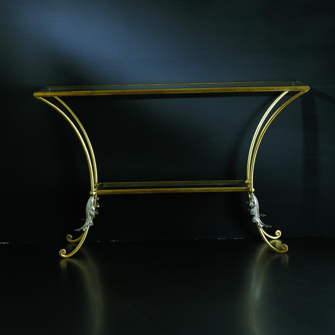 Placed behind a living room sofa or in an entryway, this French-style console will add a vintage accent to a variety of interior decors with its open Silhouette and understated elegance. Crafted of wrought iron with gold finish, it features long