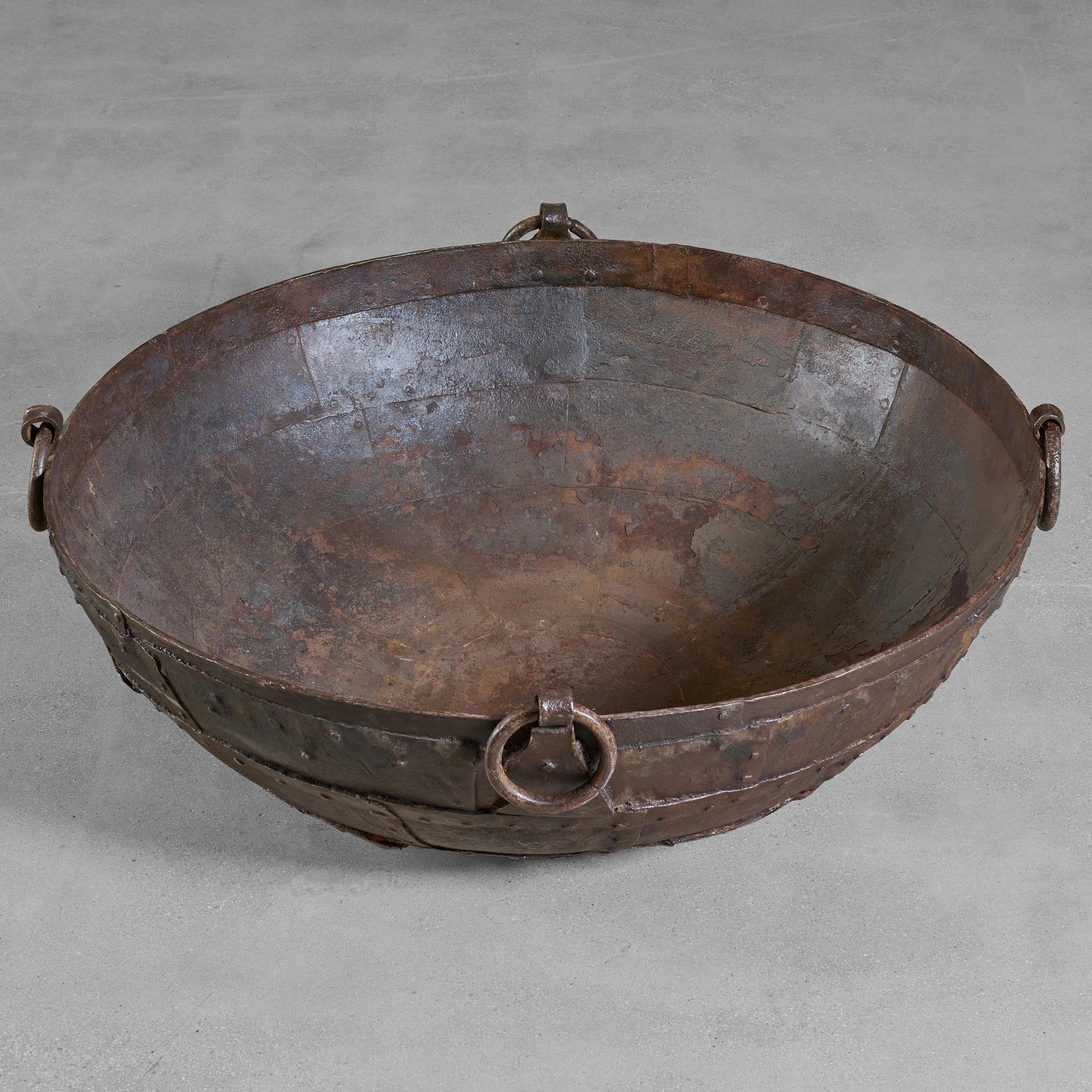 Hammered and riveted Iron vessel used for cooking. With four wonderful handles.