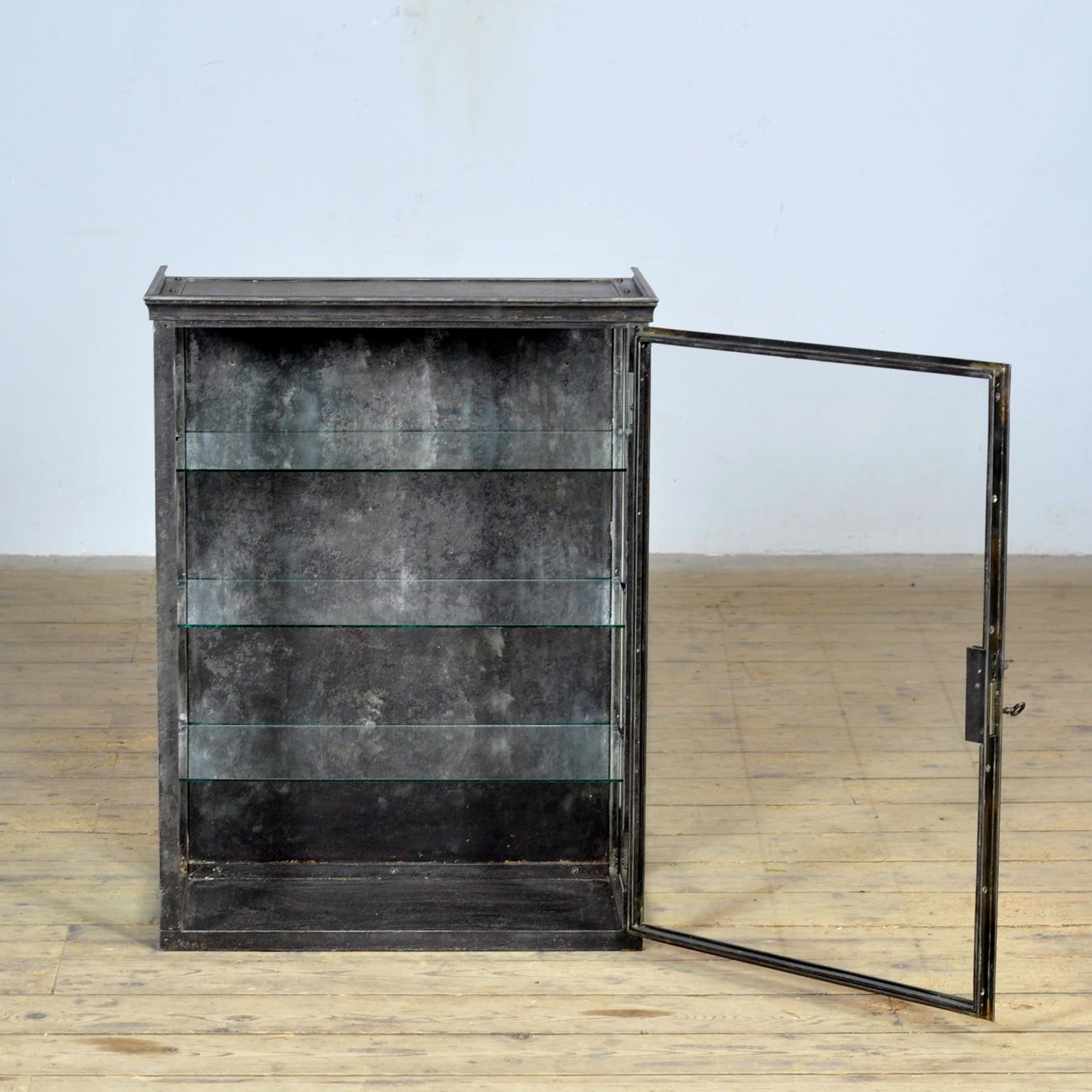Polished Iron display cabinet, circa 1920 For Sale