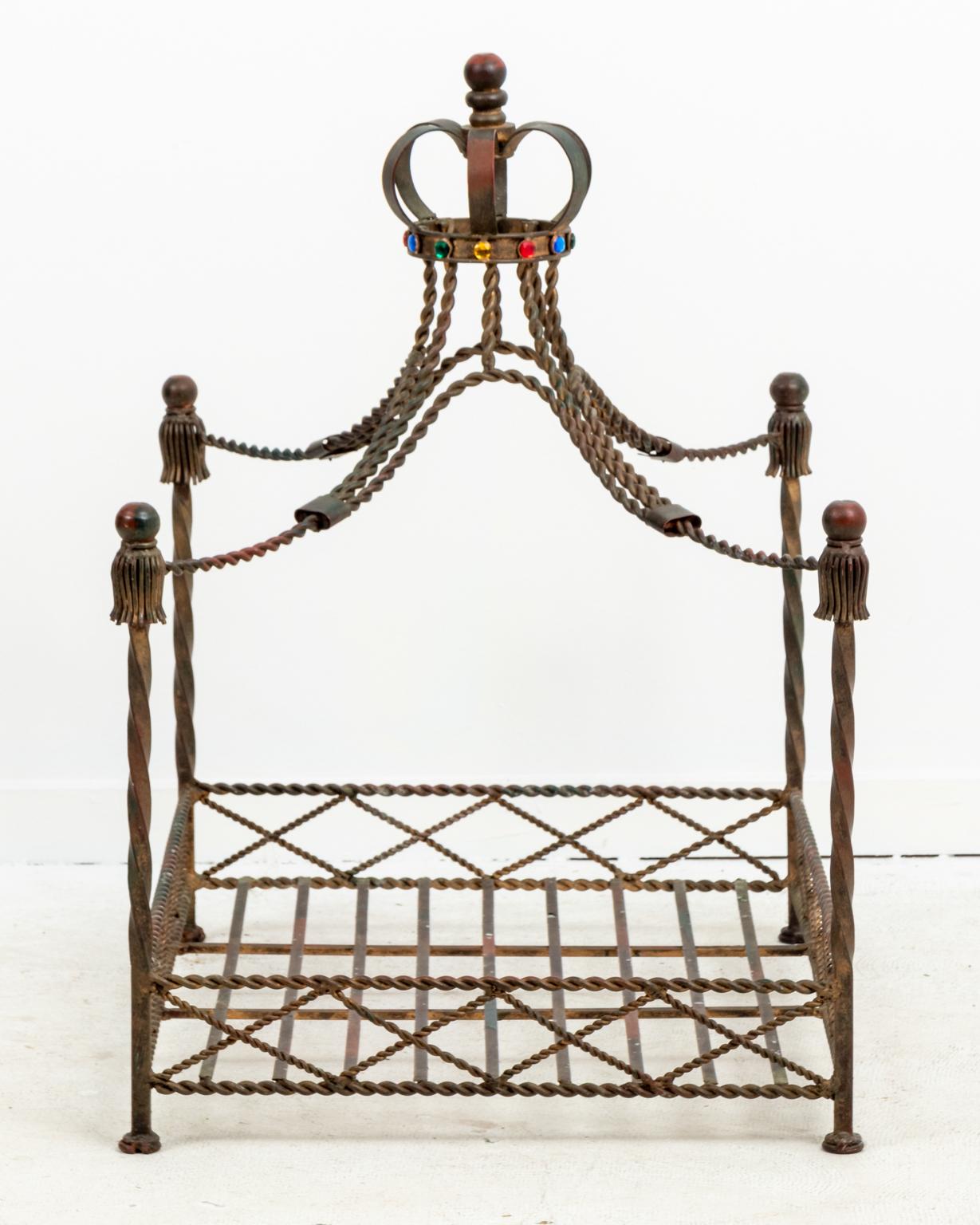 Iron dog bed with jeweled crown on top of the Iron canopy in a worn, gilt finish, circa 1980s. Made in Italy. Please note of wear consistent with age including patina.