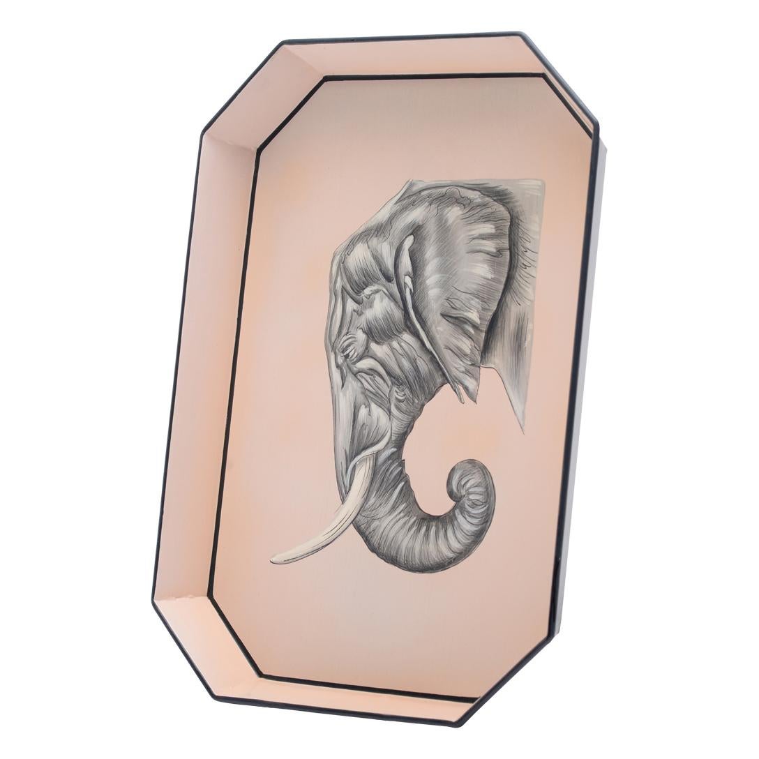 This exquisite tray is a unique piece of craftsmanship from Les Ottomans, showcasing a blend of artistry and functionality.

The tray is crafted in the shape of an elephant, a symbol often associated with strength and wisdom. The elephant’s form is