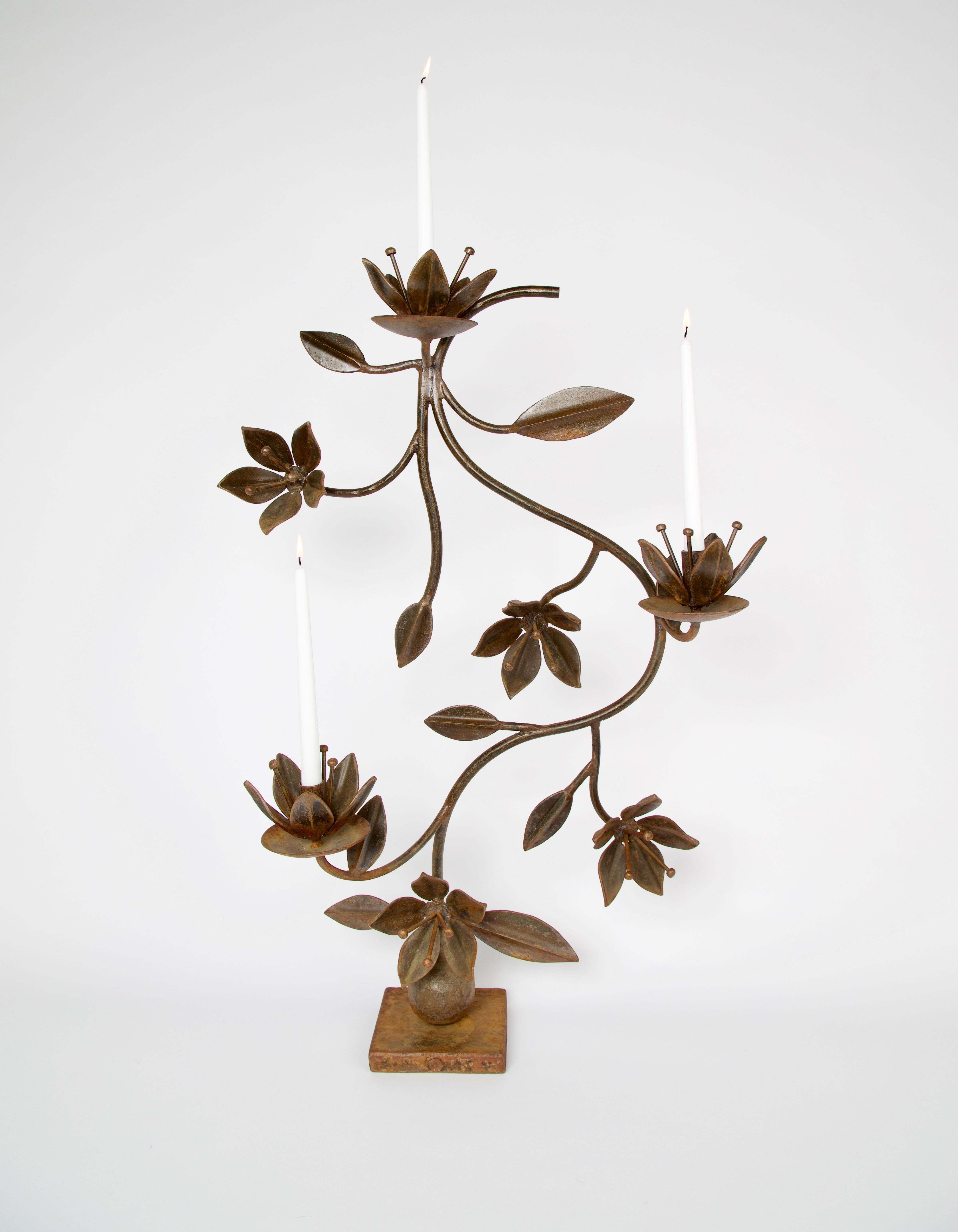 A earlier retired Iron floral candelabra by Jan Barboglio titled 