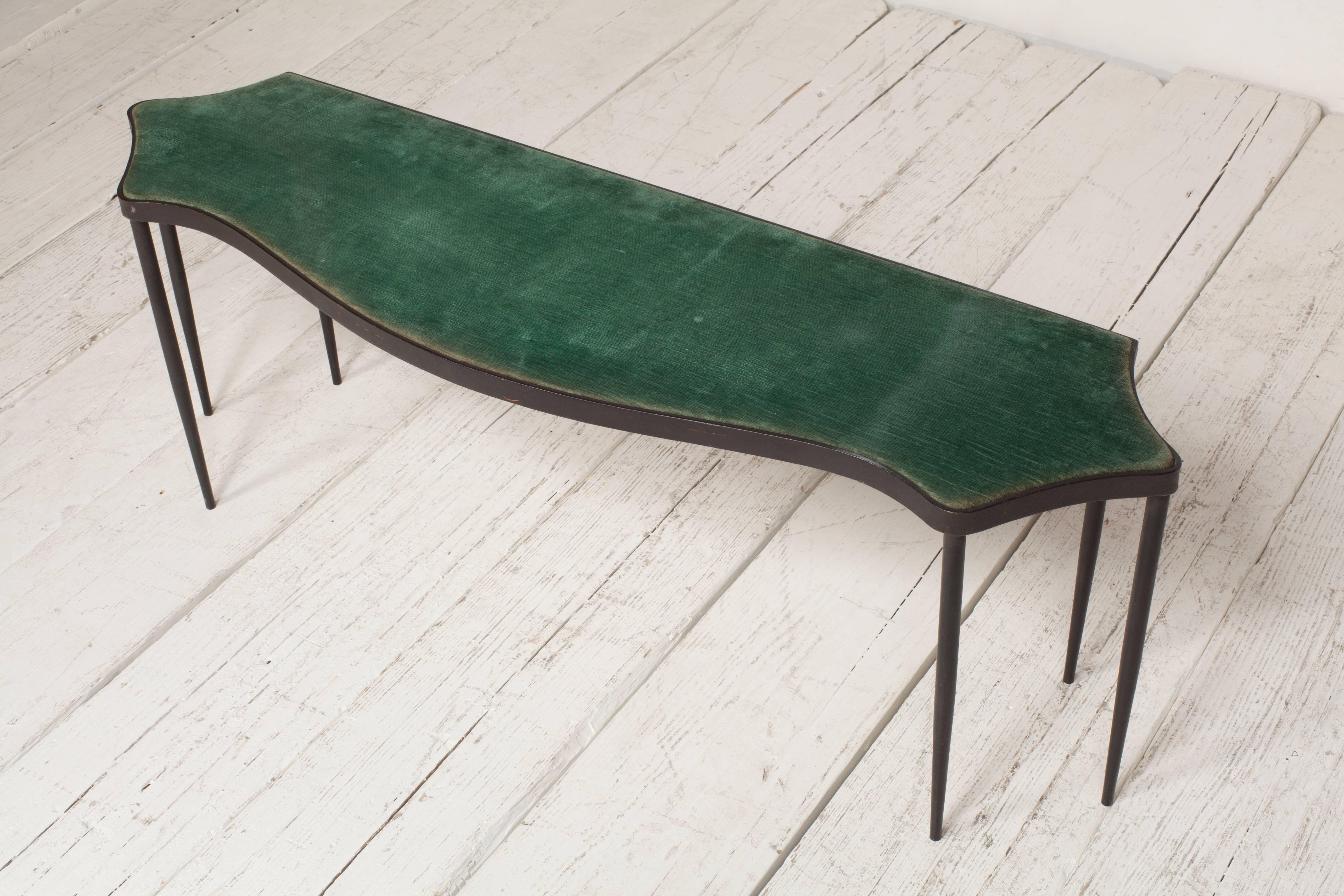 Low French iron framed bench with six tapered legs upholstered in original green velvet.