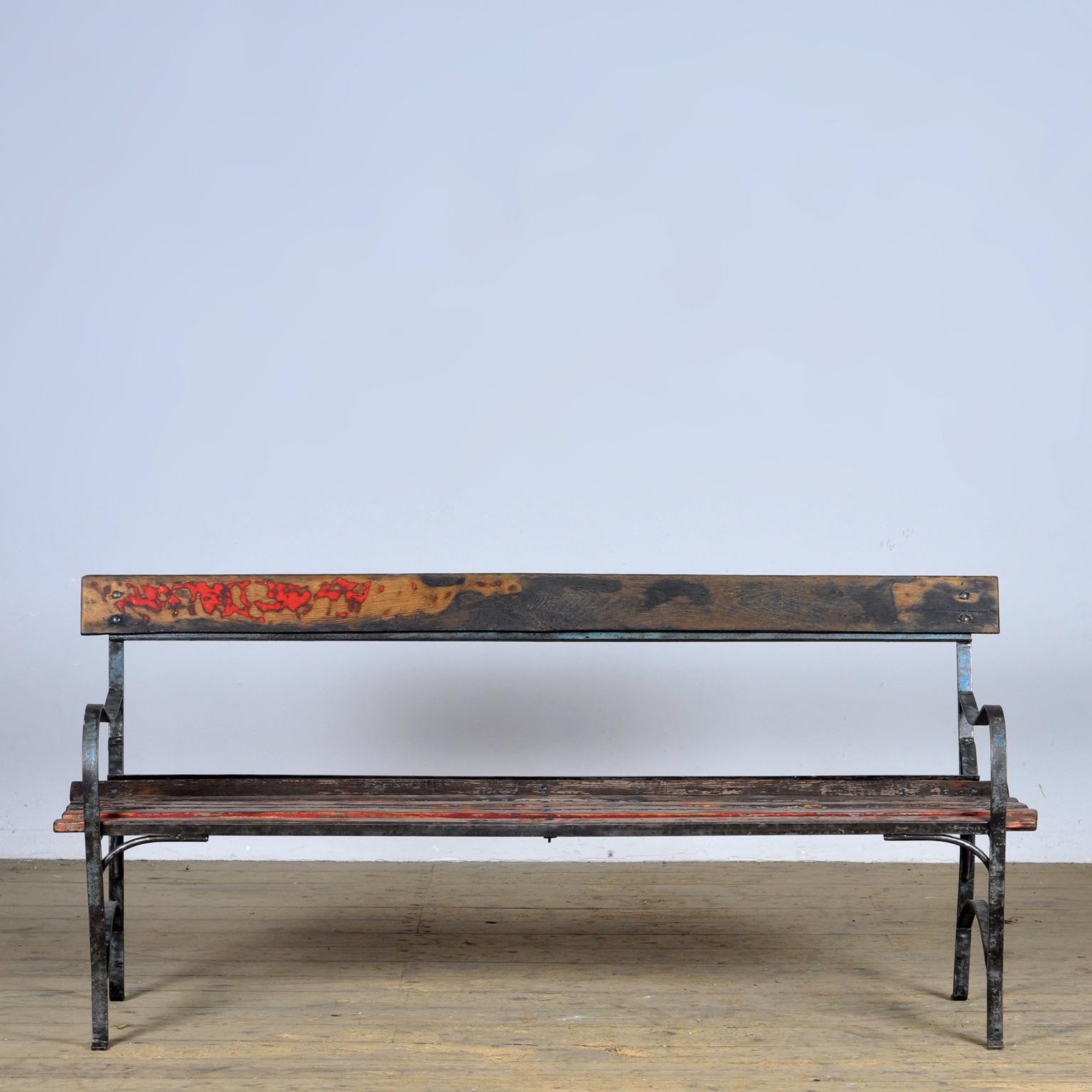 Garden bench from the 1930s. With a heavy iron base and pine seating. Very nice vintage condition. Seat height: 43 cm. 