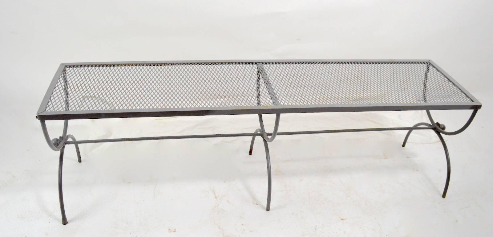 Modernist, neoclassical style bench attributed to Woodard. Nice example suitable for indoor and or outdoor use, currently in later grey paint finish, which shows wear. Usable as is, or we offer custom powder coating if you want a more finished look.