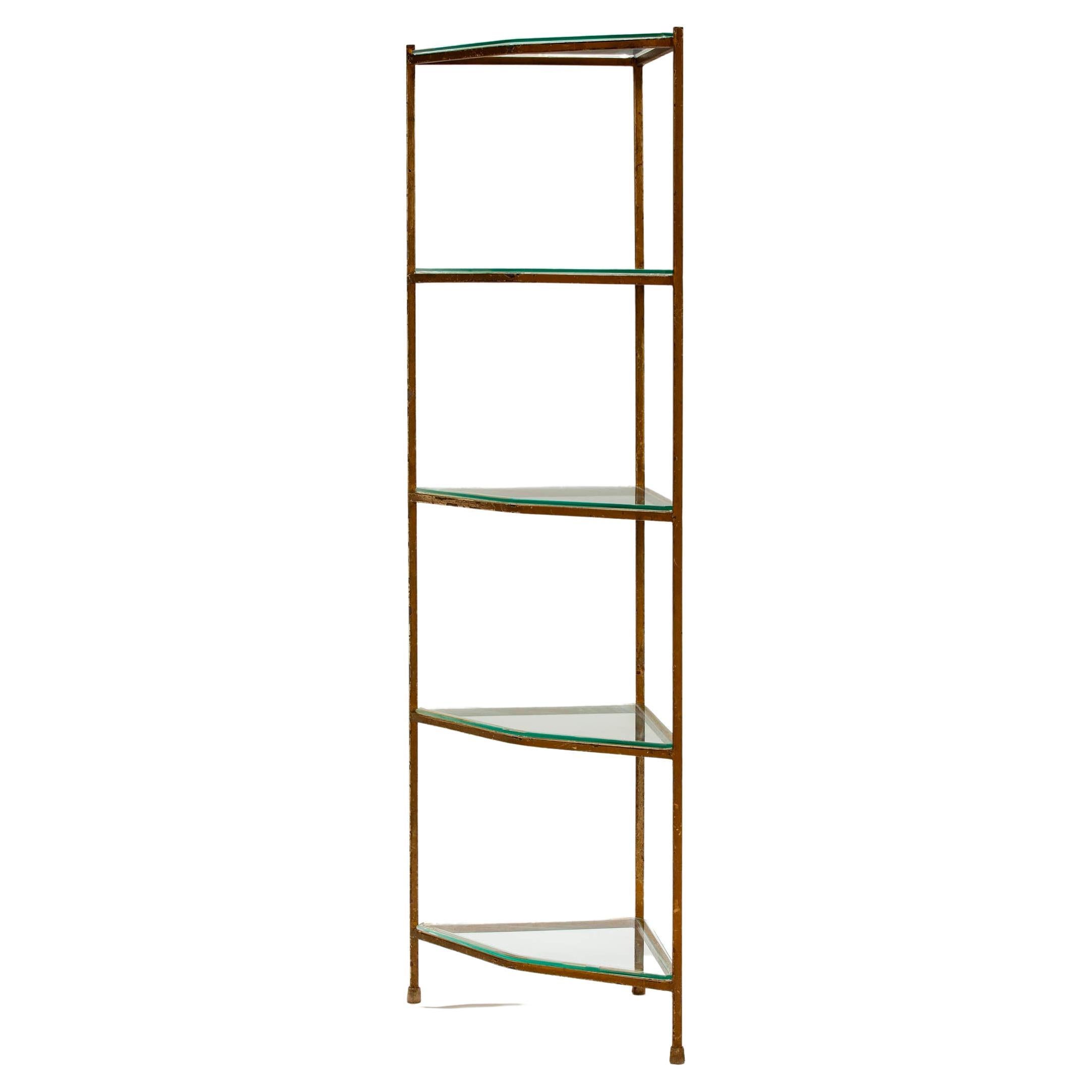 Great for tight spaces, a triangular etagere in iron, with new glass shelving. 