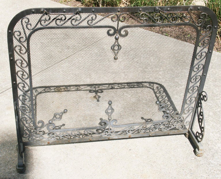 3-1098 Hand forged iron fireplace screen with intricate detail 1920's.