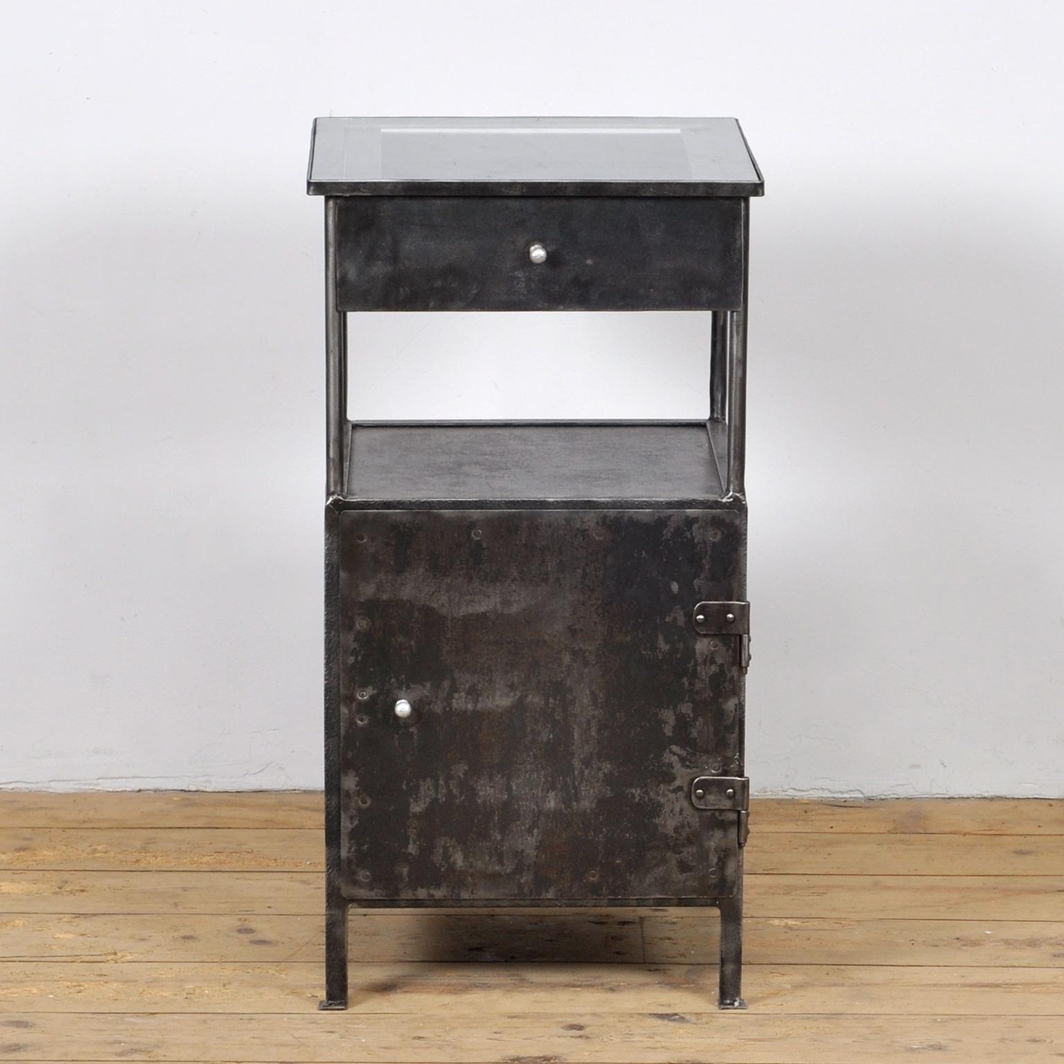 Iron hospital bedside table with a glass top. The item has been stripped from its paint. Treated against rust. Circa 1910. 