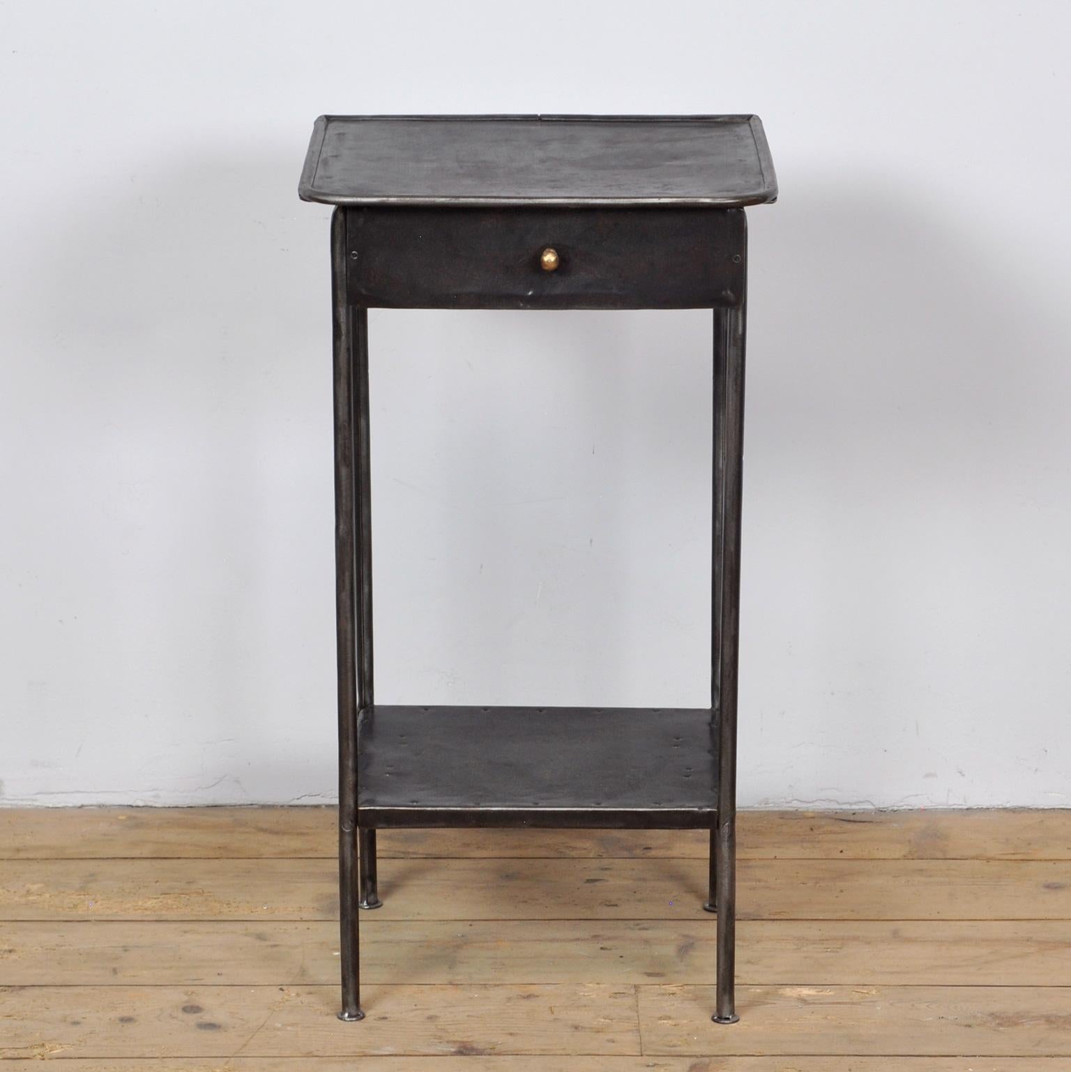 Iron hospital bedside table. The item has been stripped from its paint. Treated against rust. Circa 1920. 