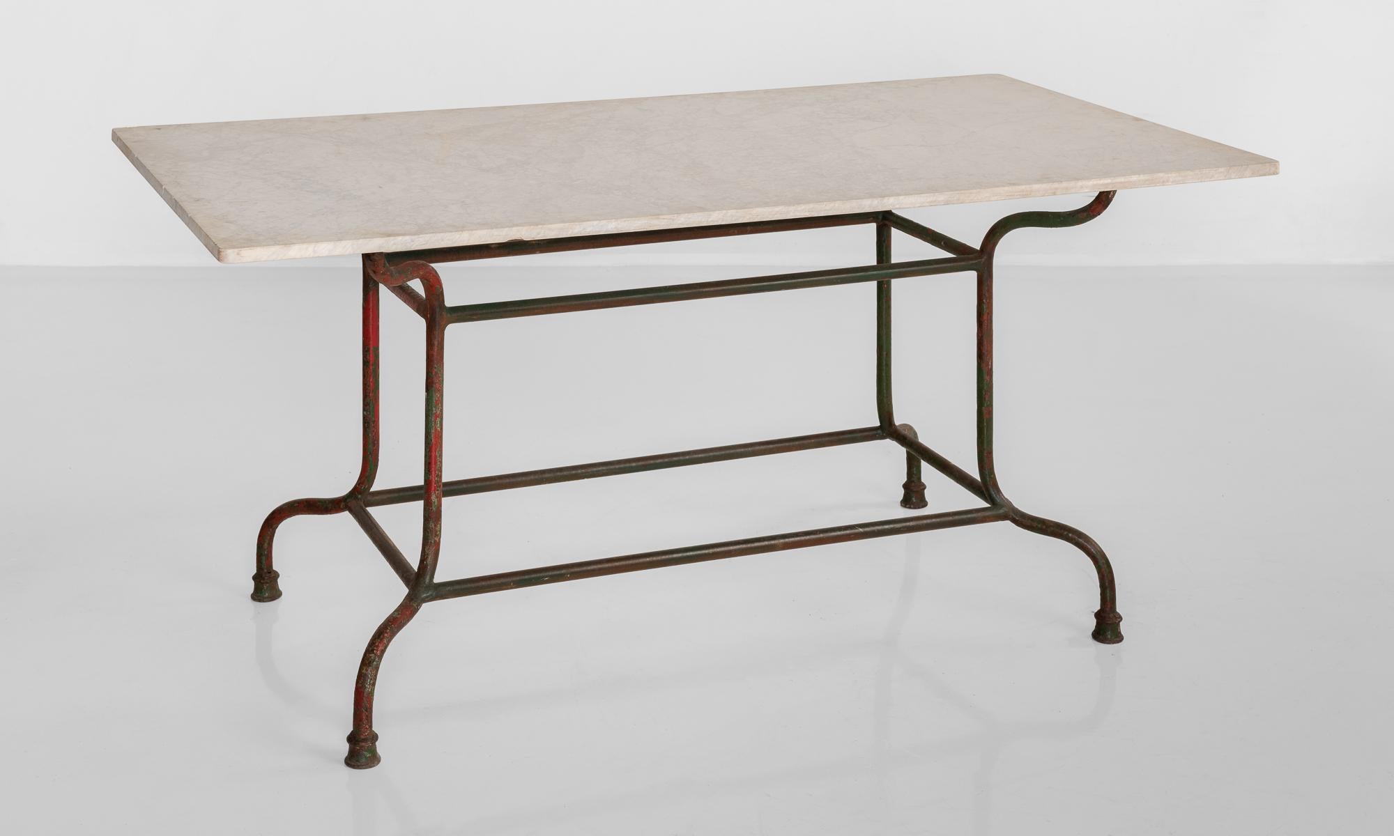 Iron & marble table, France, circa 1920.

Beautiful slab marble top on Iron base with original red paint.