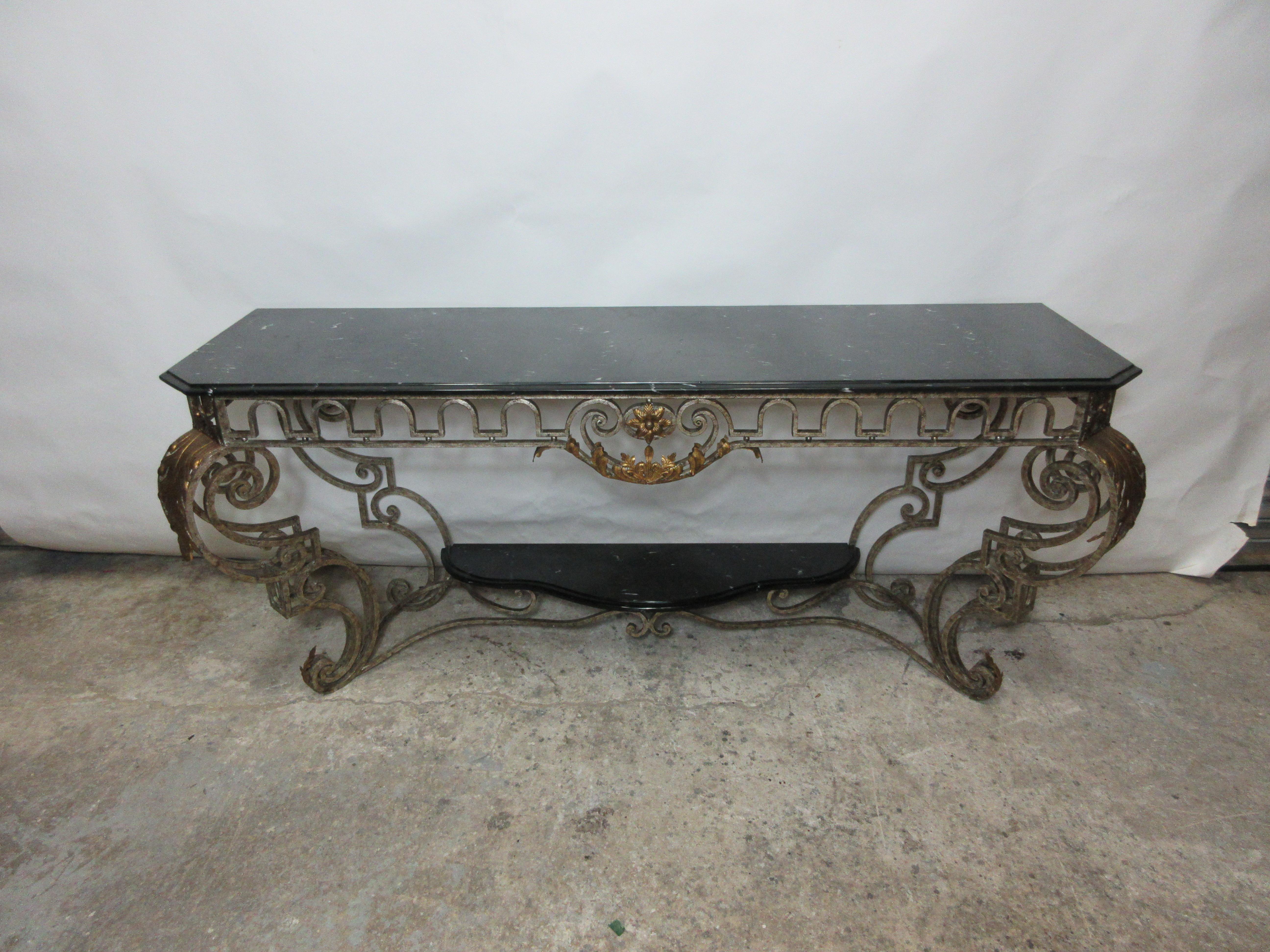 This is an iron and marble-top console table with a marble shelf at the bottom.