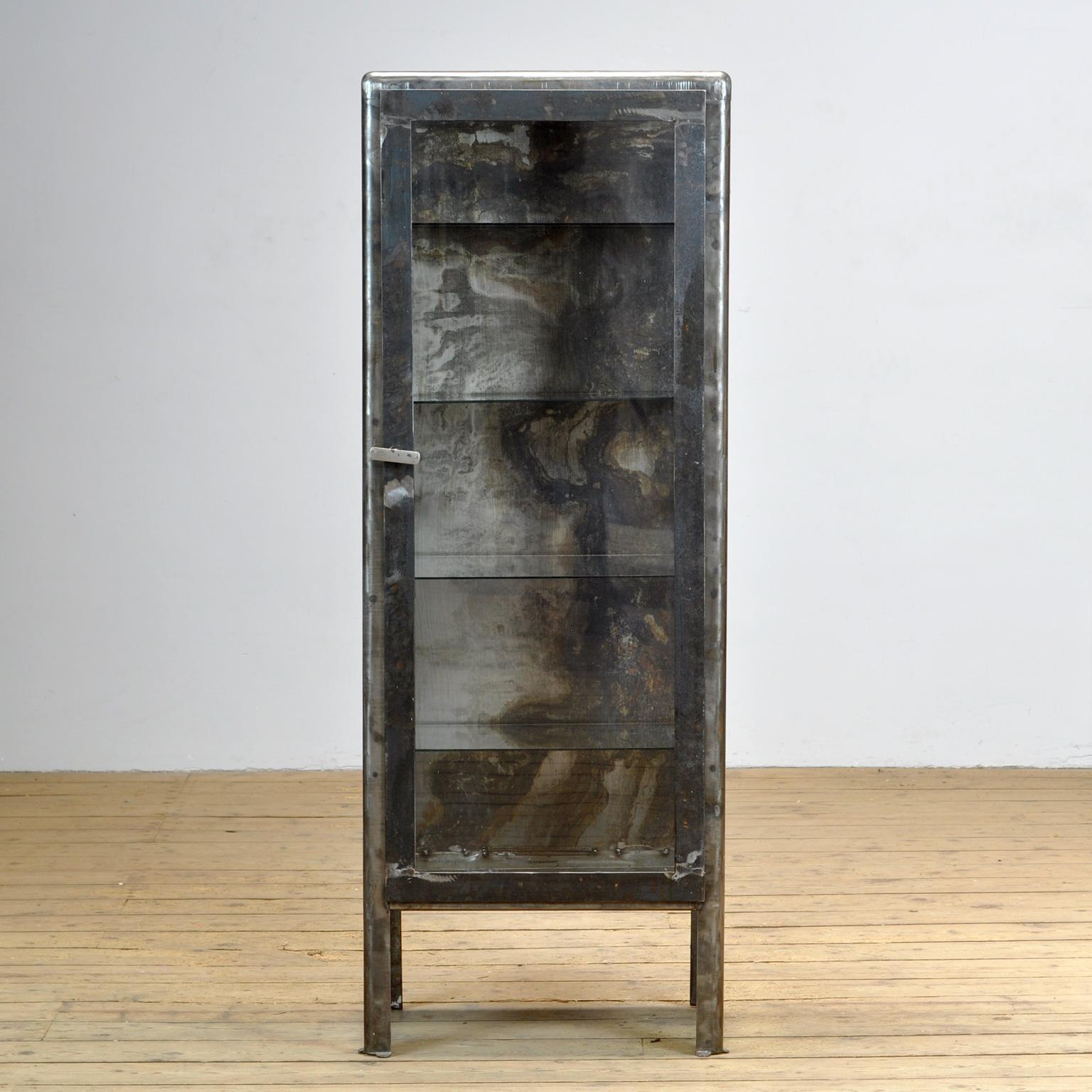 Iron medical cabinet from Ukraine. Produced in the 1970s.
The cabinet has been stripped down to the metal. The cabinet comes with 4 glass shelves.
Space between the shelves is 28 cm.