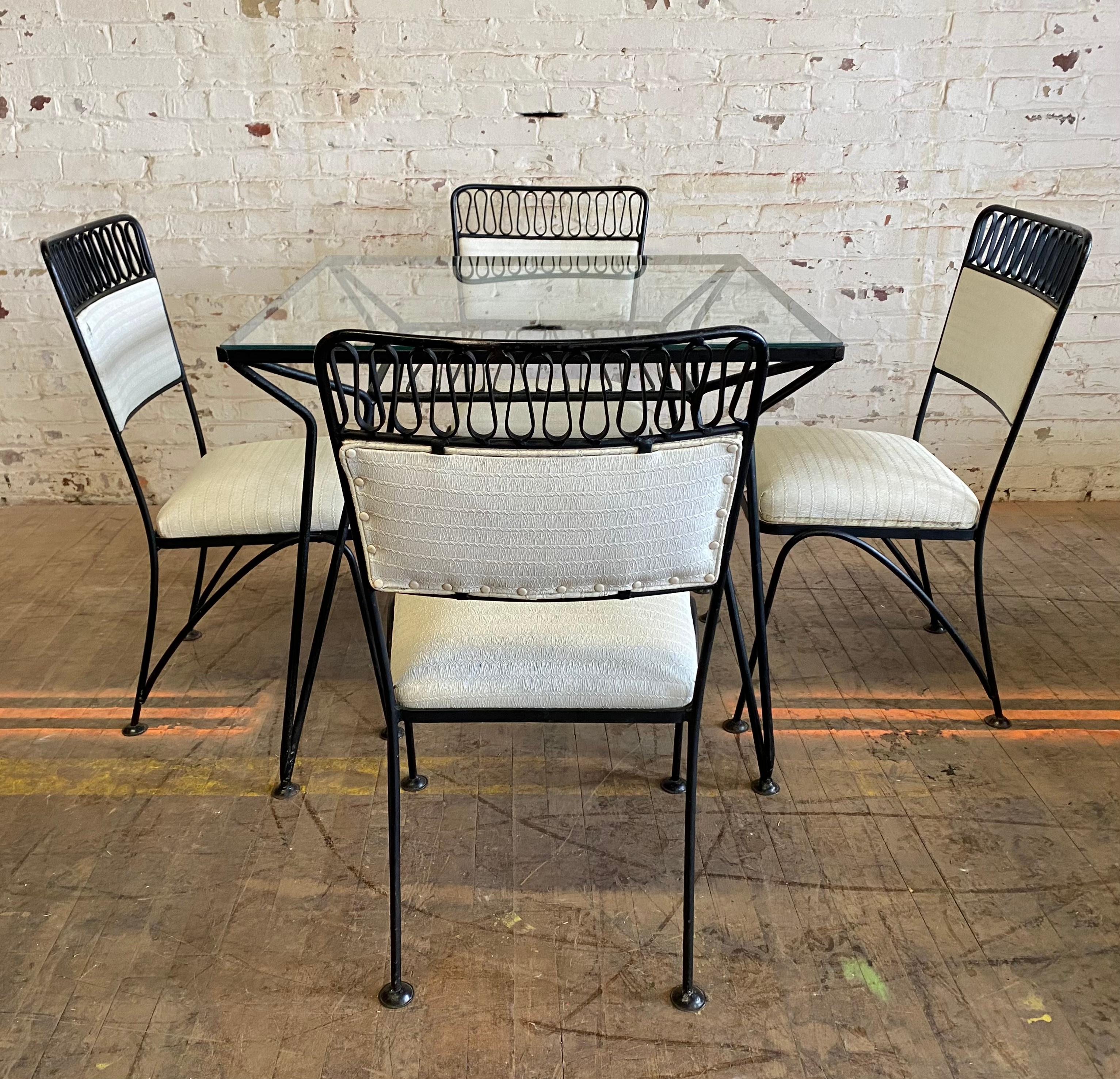 Wonderful Indoor / outdoor Iron Dinette set, table and 4 chairs attributed to John Salterini, retains original white naugahyde seat and back, great design, great size, hand delivery avail to New York City or anywhere en route from Buffalo NY.