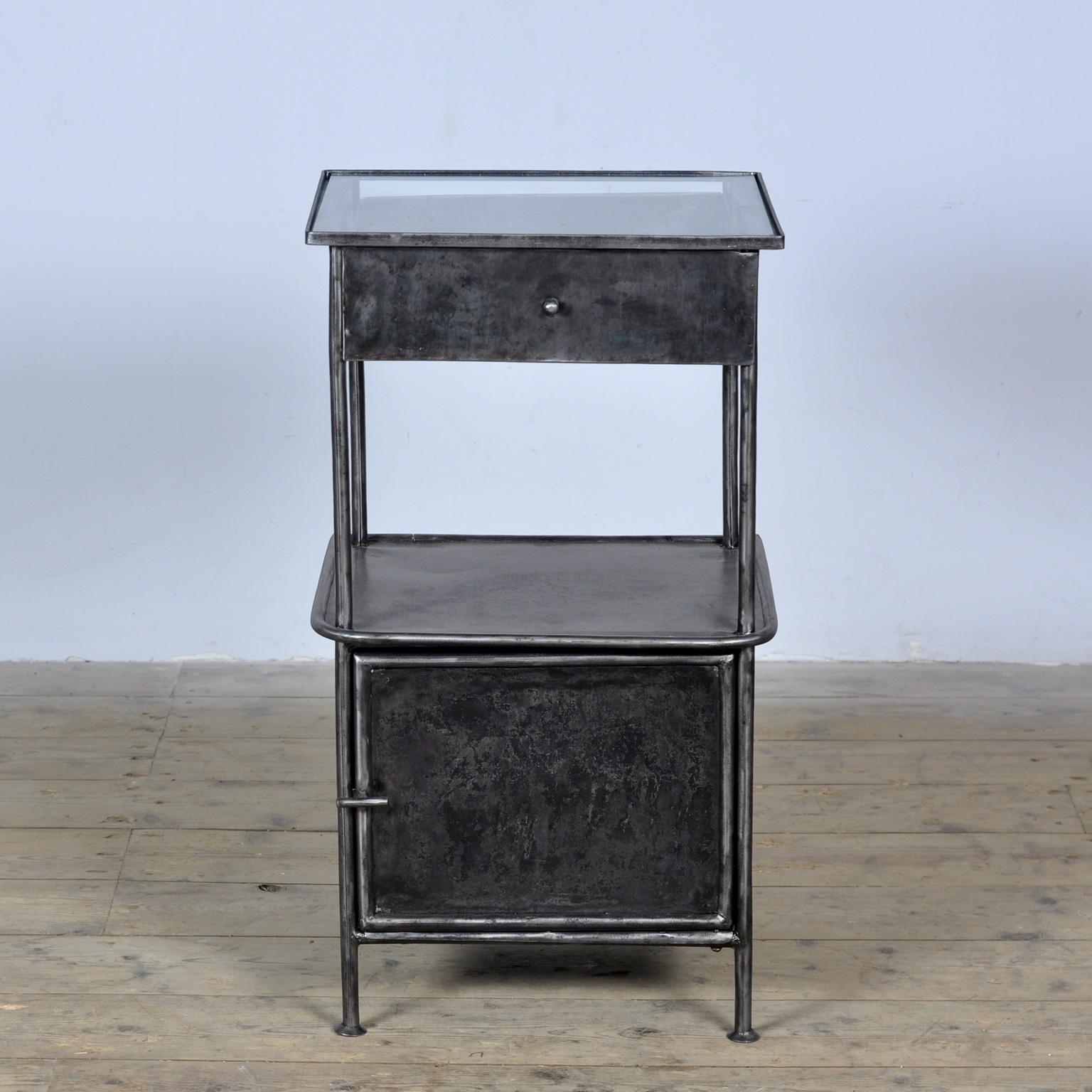 Bedside table, probably from a hospital, made of iron with a glass top. The cabinet has been stripped of paint and polished. Treated against rust. Circa 1910. The drawer has rust damage, see photo.