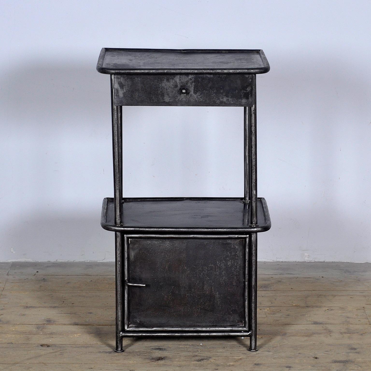 Bedside table made of iron from a hospital in Budapest. Stripped to the metal and polished. Circa 1910.