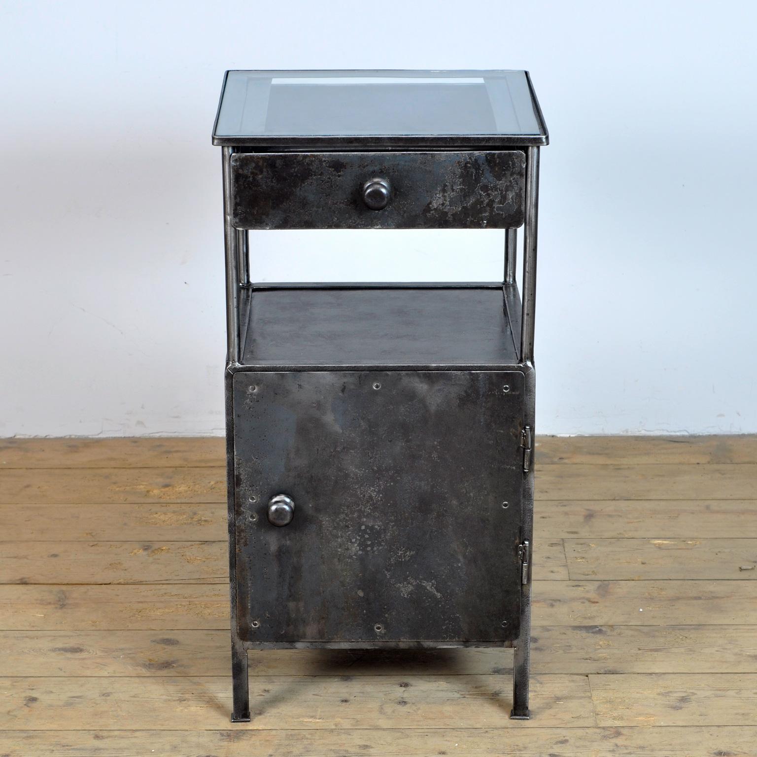 Iron hospital bedside cabinet with glass top. Produced in the 1910's in germany. 