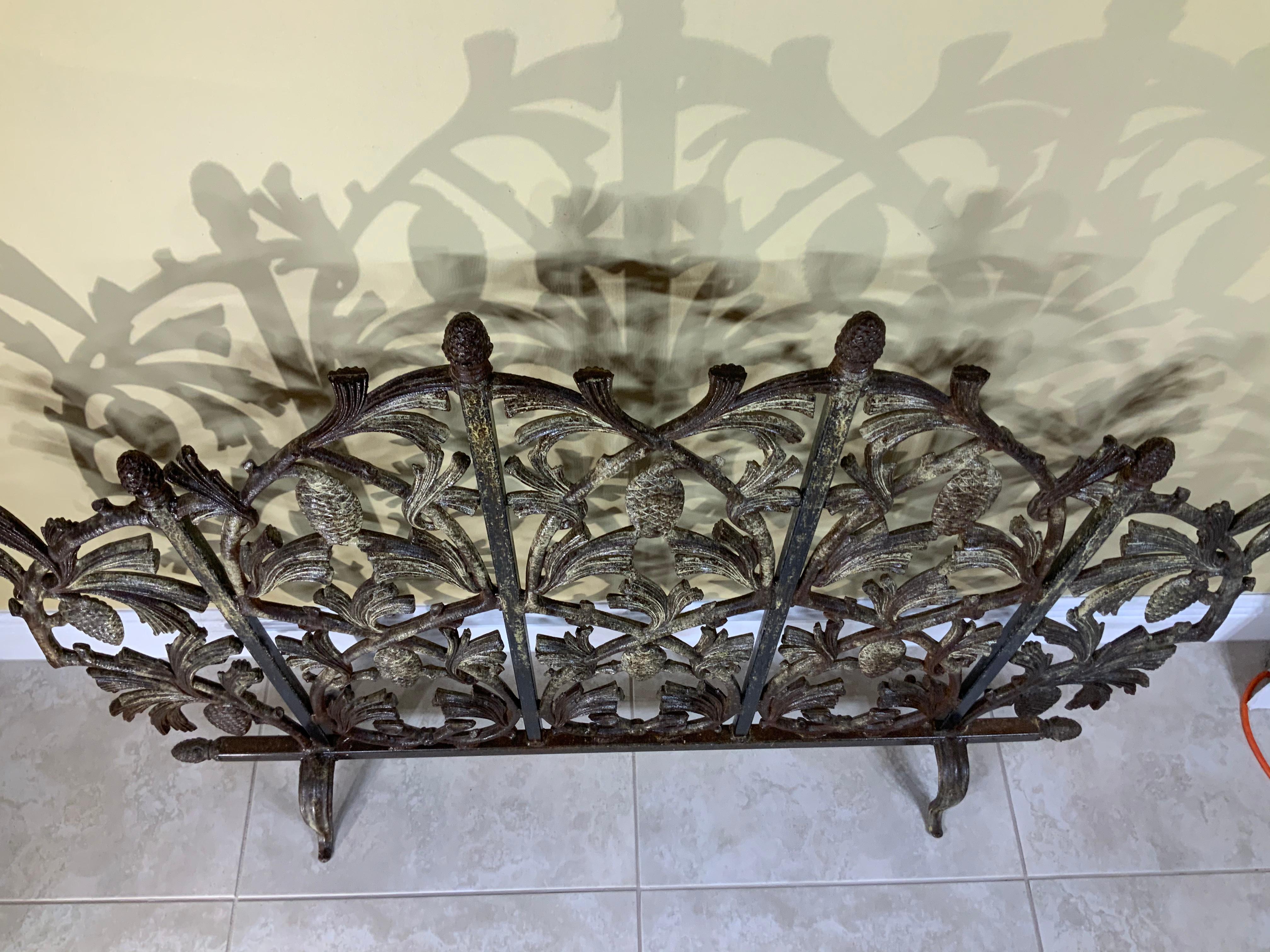 Exceptional fireplace screen made of cast iron with vines and pinecone motifs all around, beautiful snowy patina on one side, and rustic on the others. treated and sealed for rust, great decorative object of art for the fireplace.
